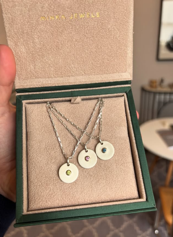 Variants of Limited Edition Colorful Sapphire Silver Disc Pendant with engraved kiss and sapphire gemstone