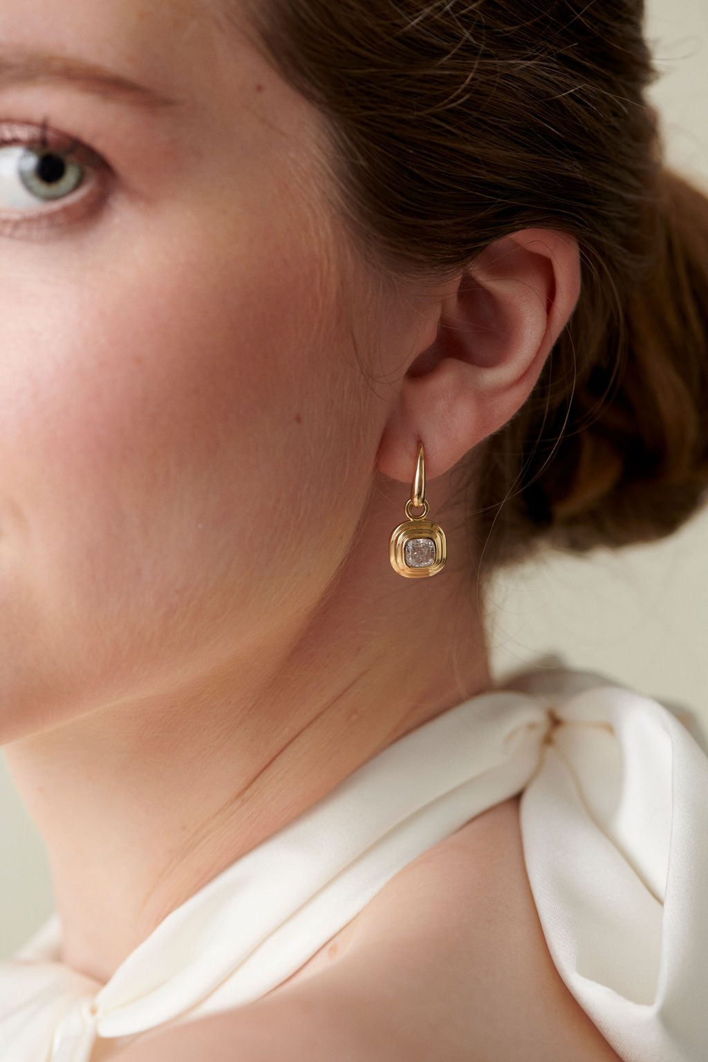 Athena diamond earrings in 18k yellow gold worn by Minka Jewels model