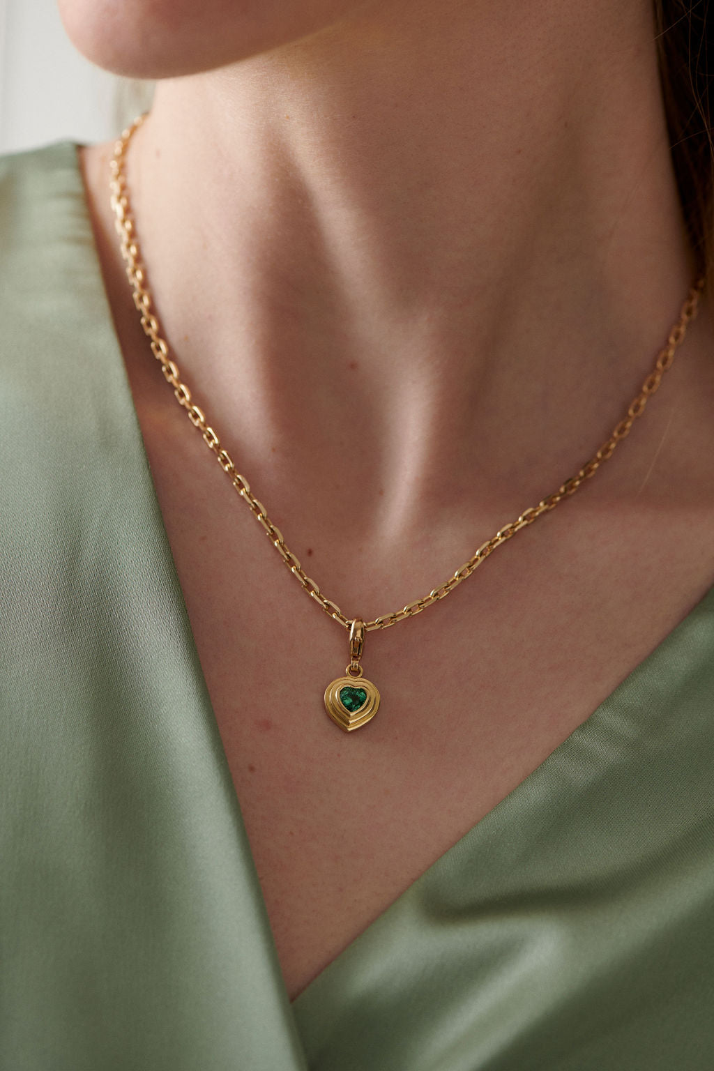 Athena heart tourmaline charm in 18k yellow gold worn on necklace by Minka Jewels model