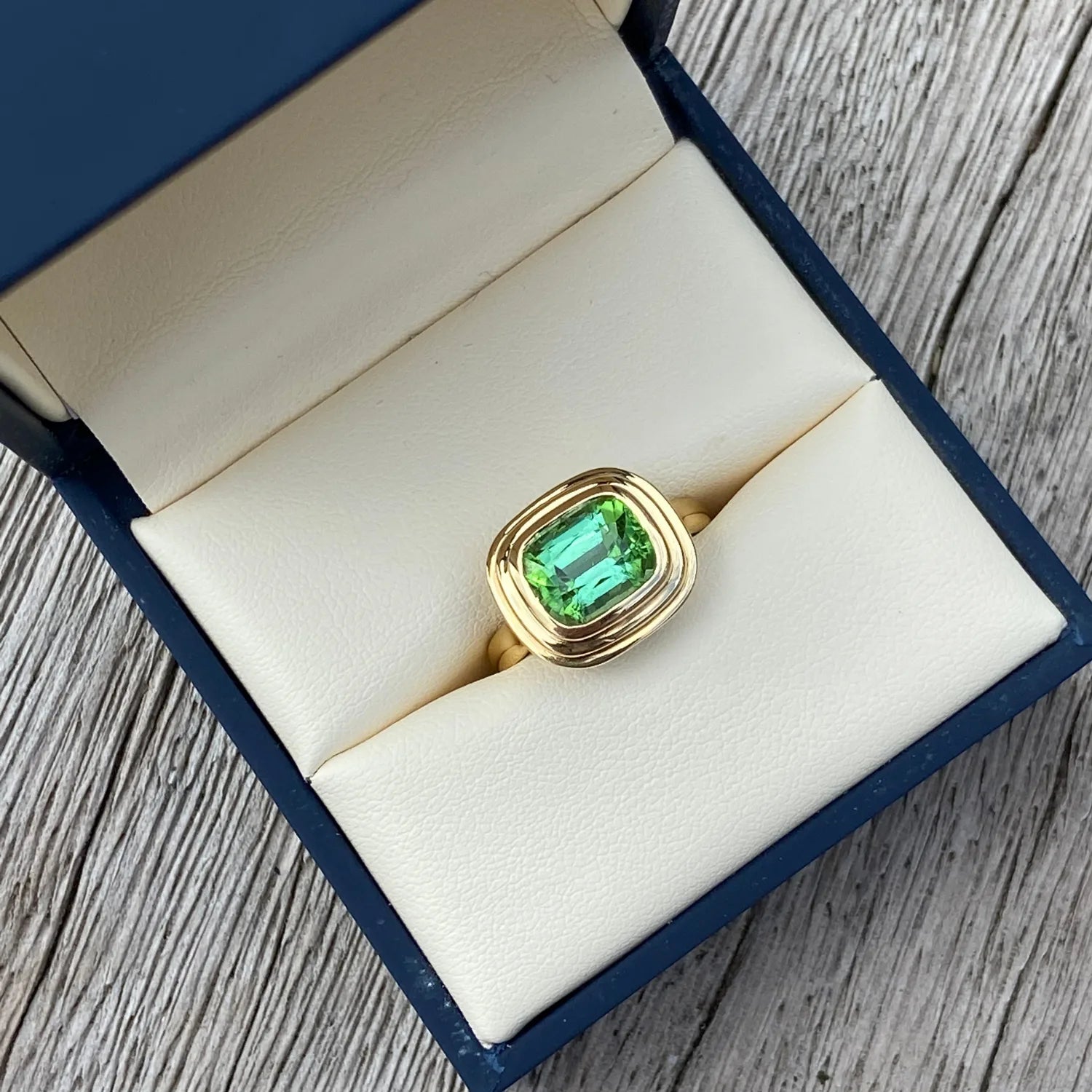 Athena Medium 3.68ct green tourmaline ring in 18k yellow gold in minkajewels jewellery box