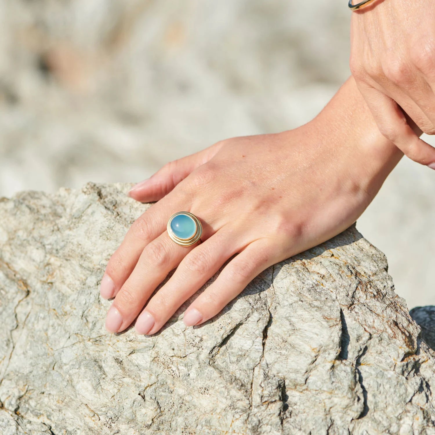 Close-up of Athena sea blue chalcedony cabochon ring in 18k yellow gold featuring 14x12mm one-of-a-kind gemstone