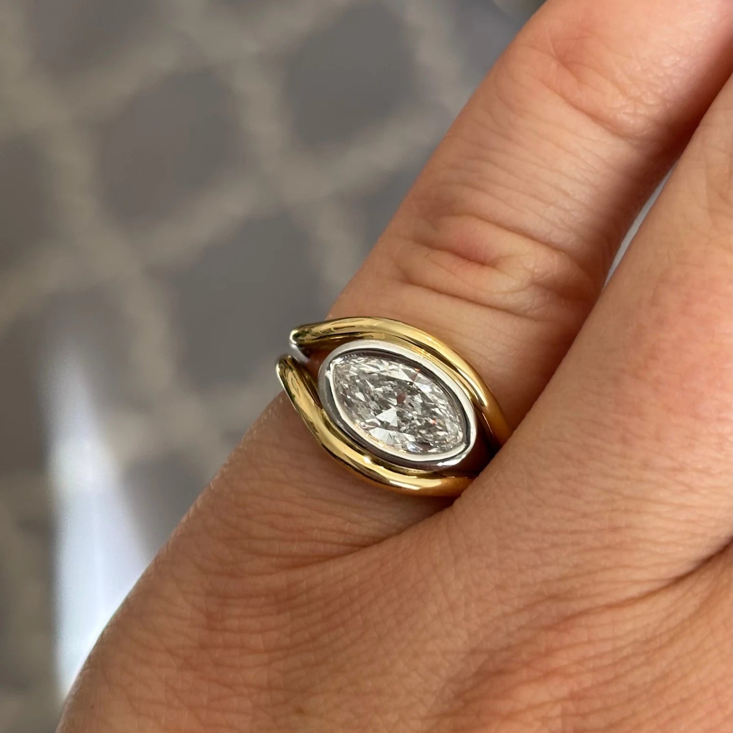 Close-up of Atlantis 1ct Diamond Mermaid Pinky Ring in yellow and white gold with 1ct oval-shaped lab-grown white diamond on mermaid tail-inspired band