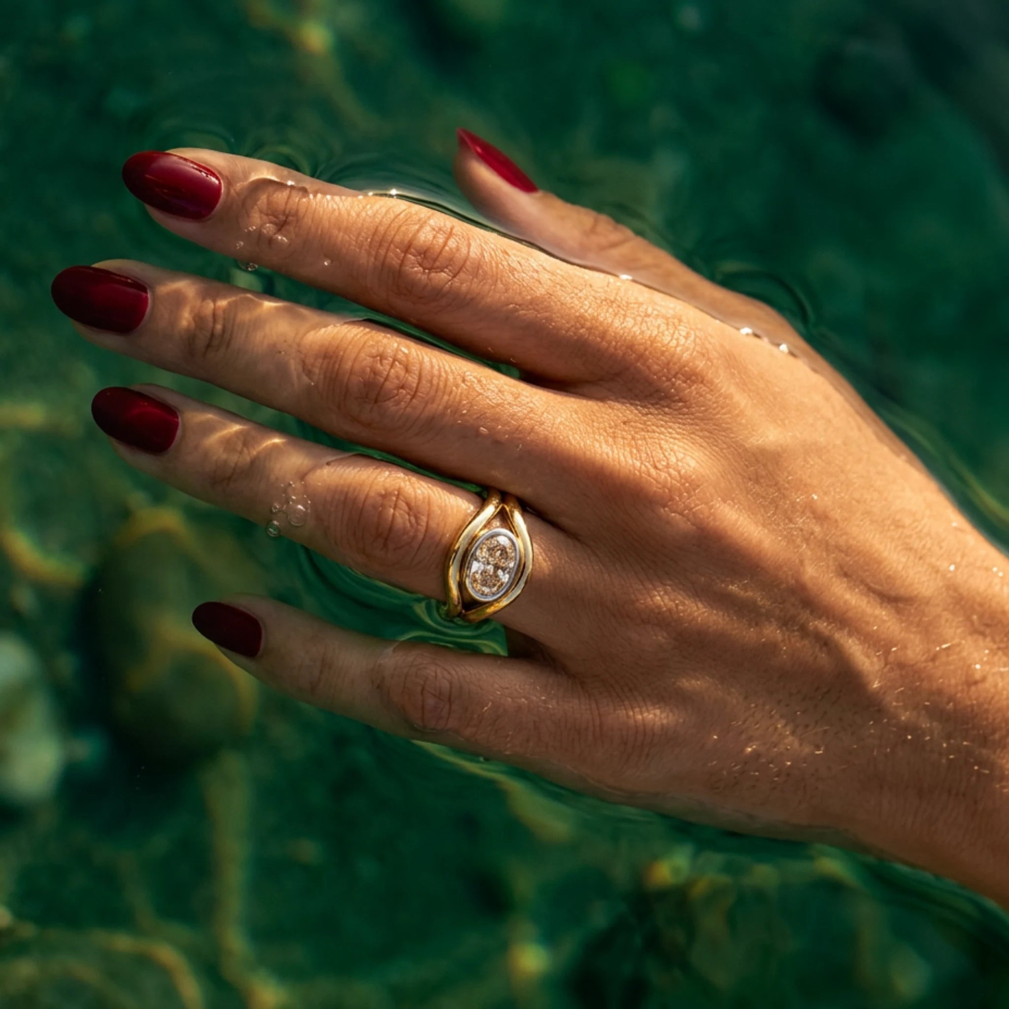 Atlantis 2.04ct brown diamond mermaid ring in yellow and white gold with oval-shaped lab-grown brown diamond in hand model