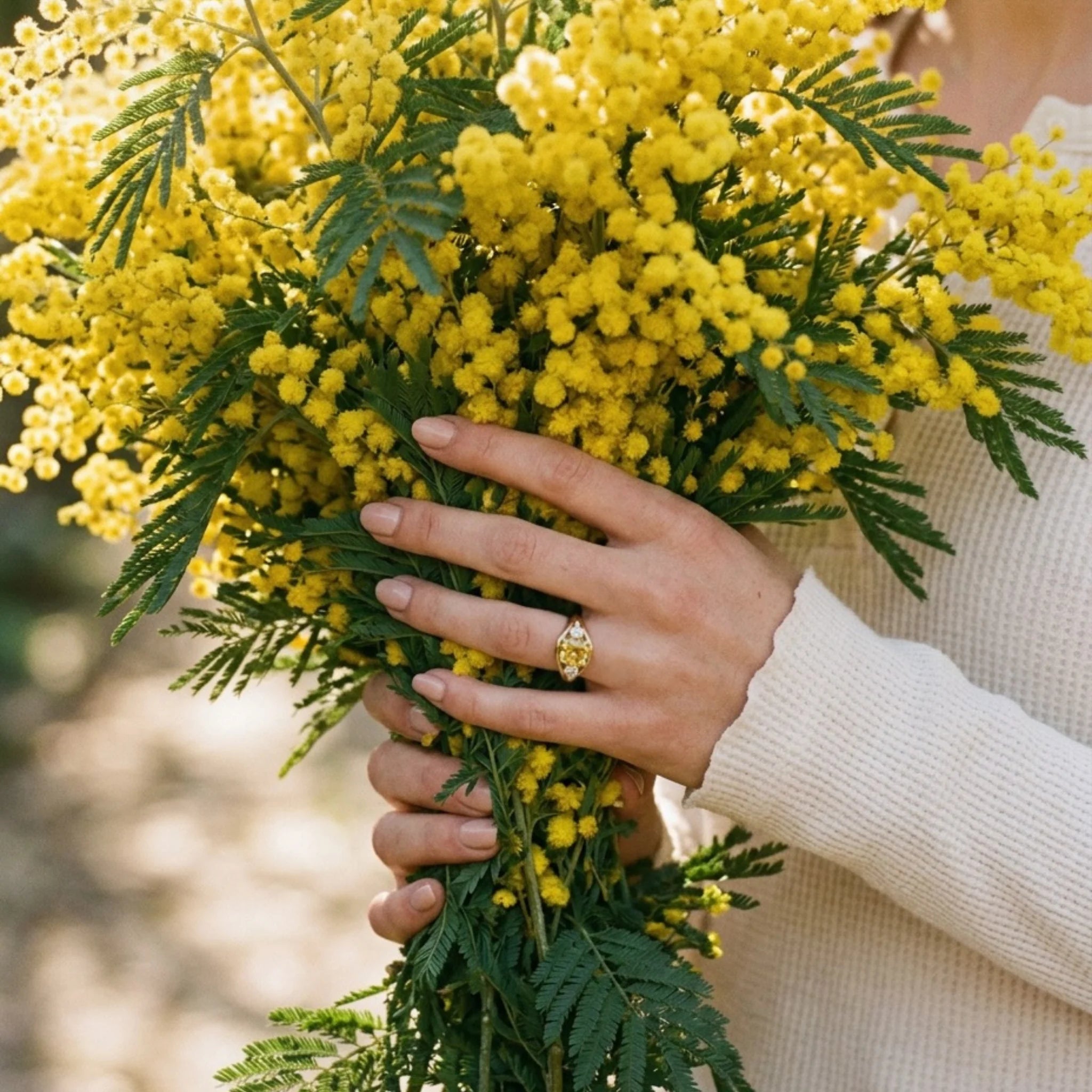 Model wearing Atlantis 2.95ct yellow sapphire mermaid ring in 18k yellow gold with square cushion-cut no-heat yellow sapphire and round white diamonds