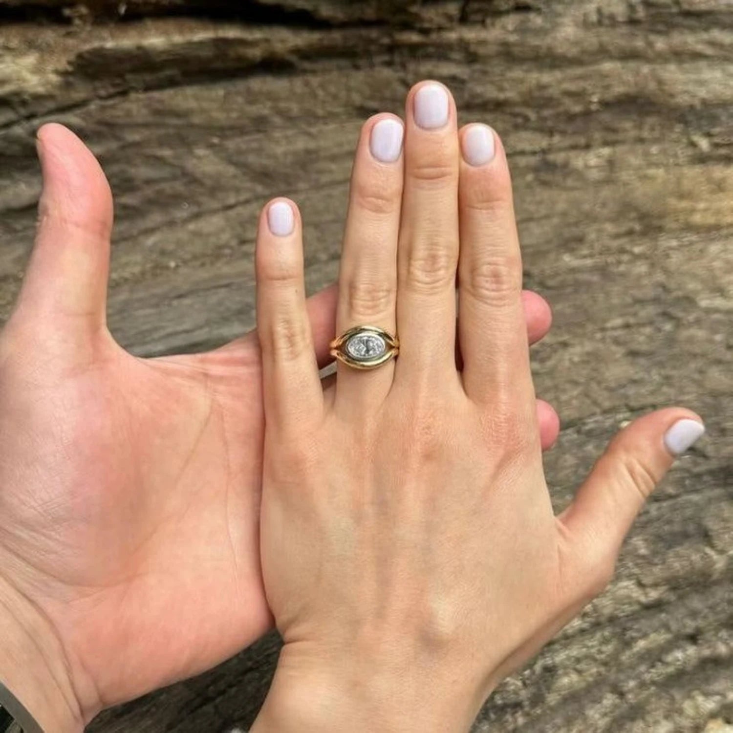 Close-up of Atlantis 2ct Diamond Mermaid Ring in yellow and white gold with 2ct oval-shaped white diamond on mermaid tail-inspired band