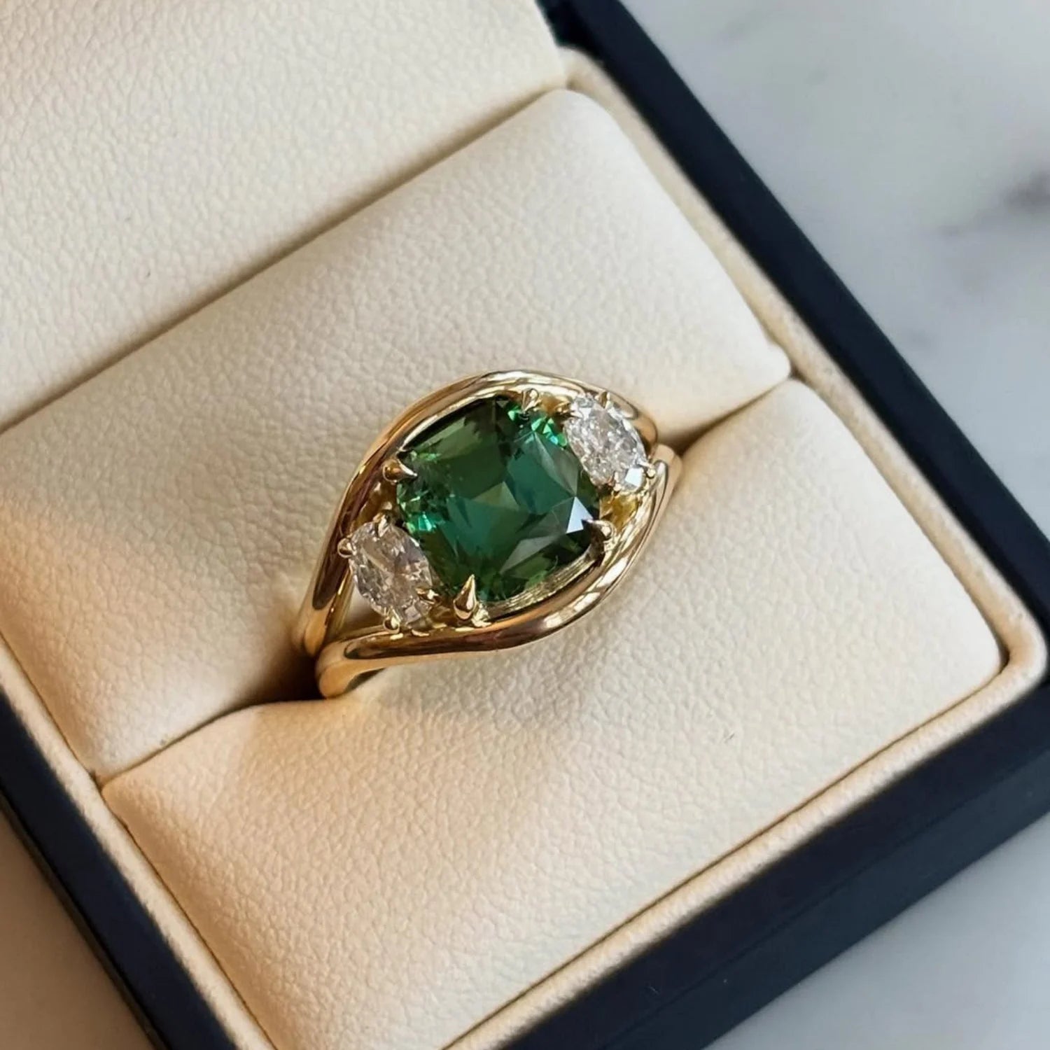 Atlantis 4.70ct vivid green tourmaline mermaid ring in 18k yellow gold with 0.65ct white diamonds displayed in a jewellery box