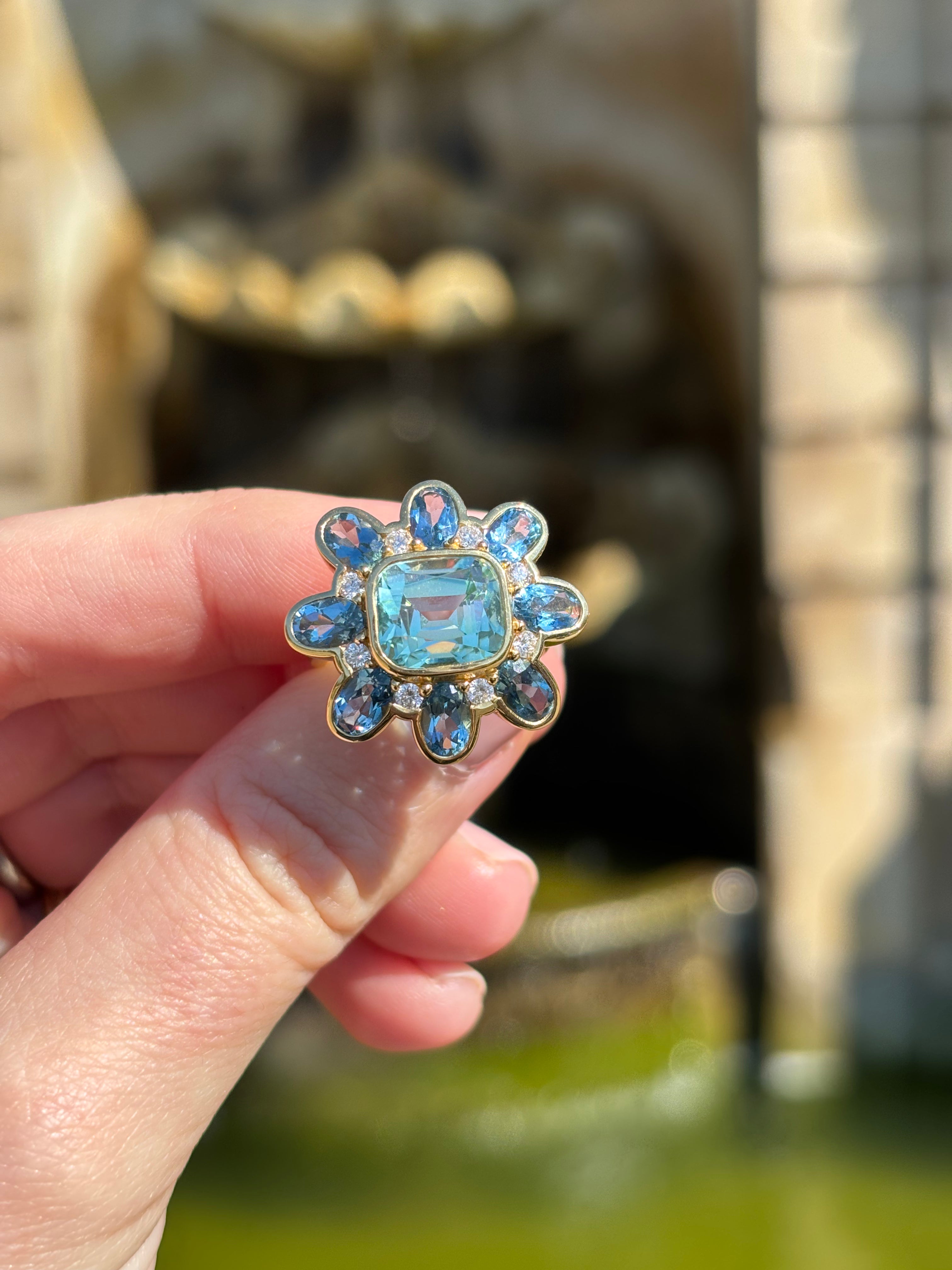 Flower shaped Atlantis collection 18k yellow gold ring featuring 5.30ct green Tourmaline, 3.39ct Aquamarine, and diamonds