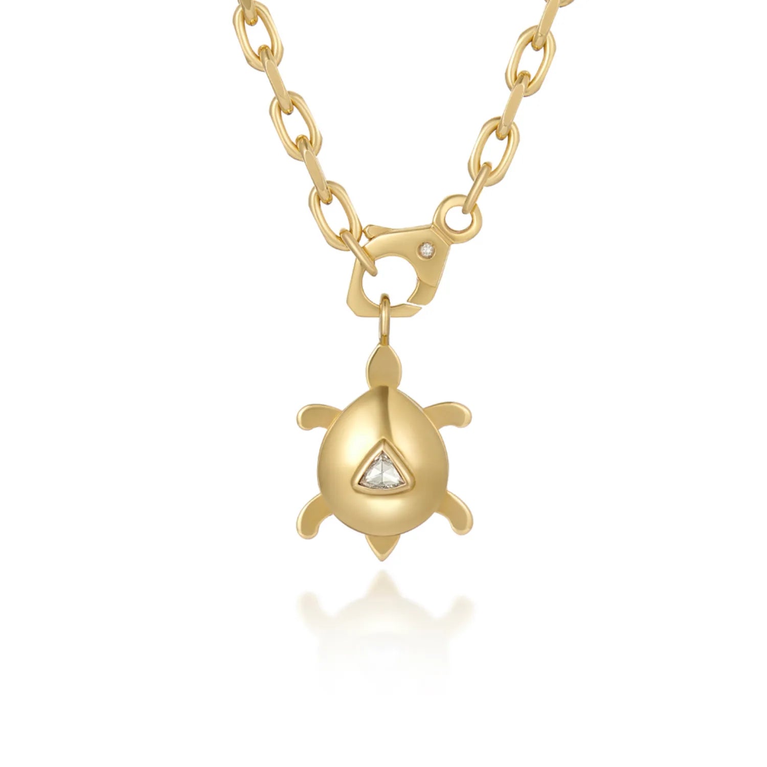 Atlantis dancing turtle diamond charm in solid 18k yellow gold with trillion-cut diamond attached to a necklace chain