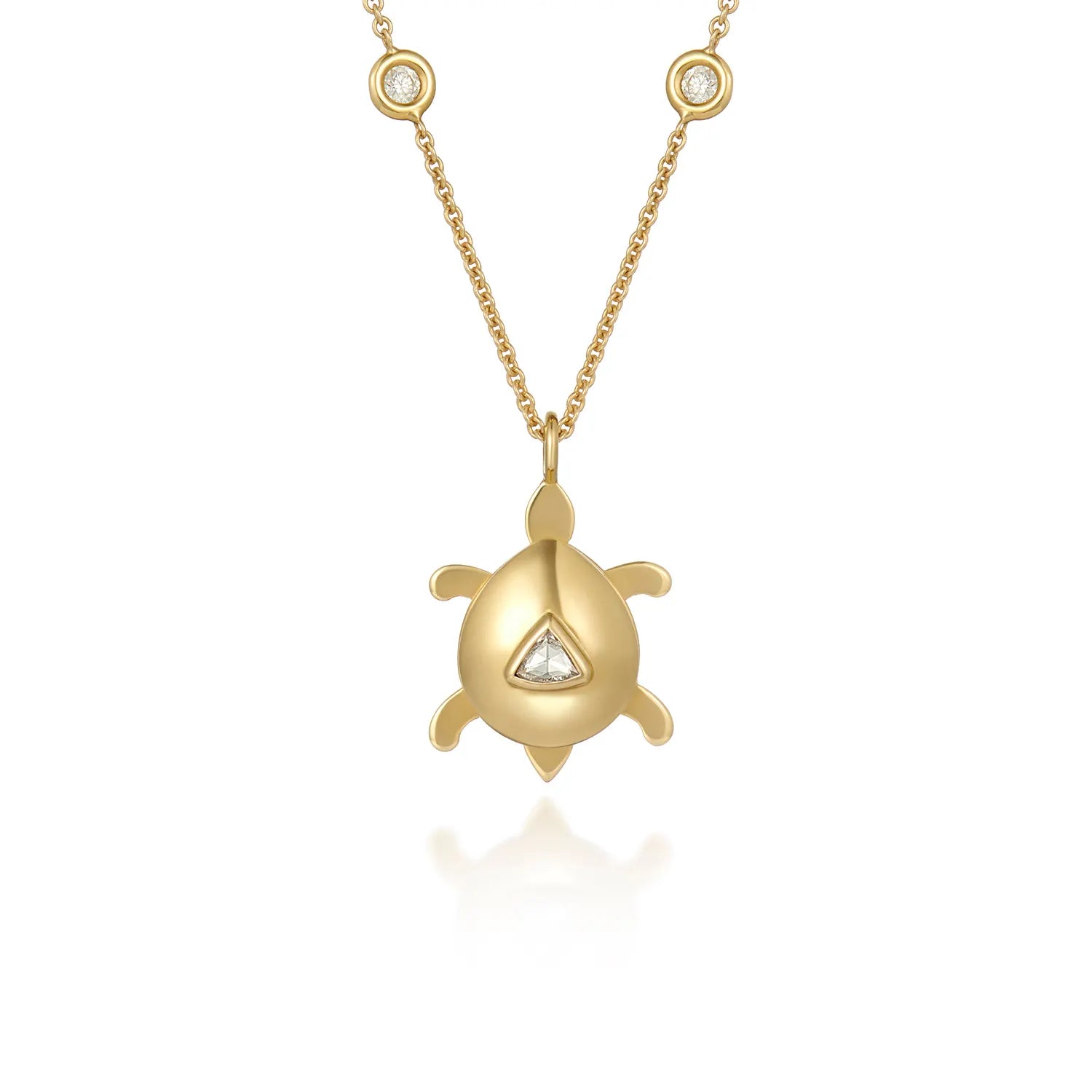 Atlantis dancing turtle diamond charm in solid 18k yellow gold with trillion-cut diamond attached to a necklace chain