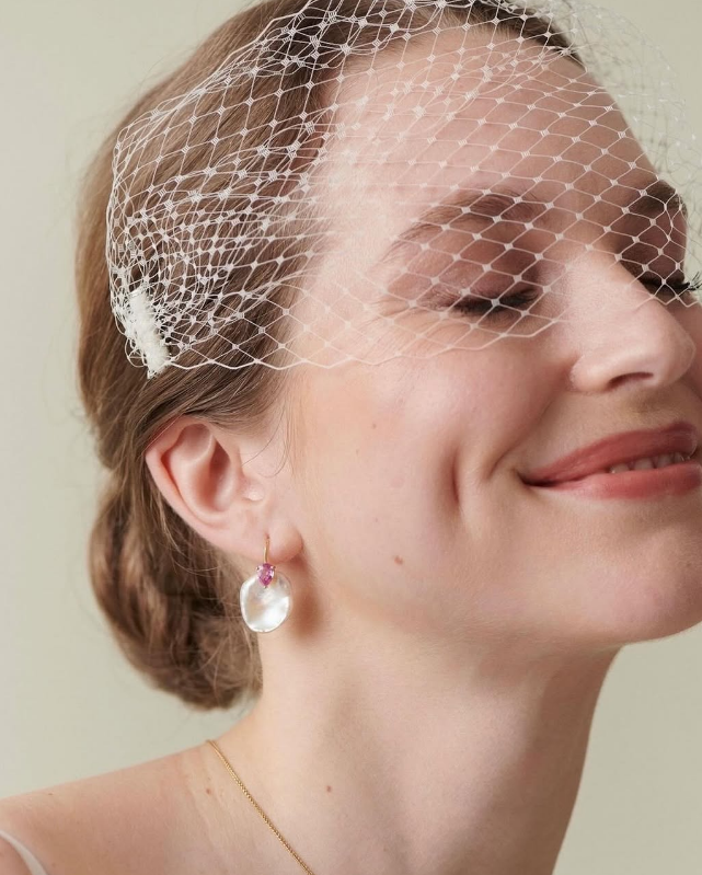 Atlantis sapphire and keshi pearl earrings worn by model