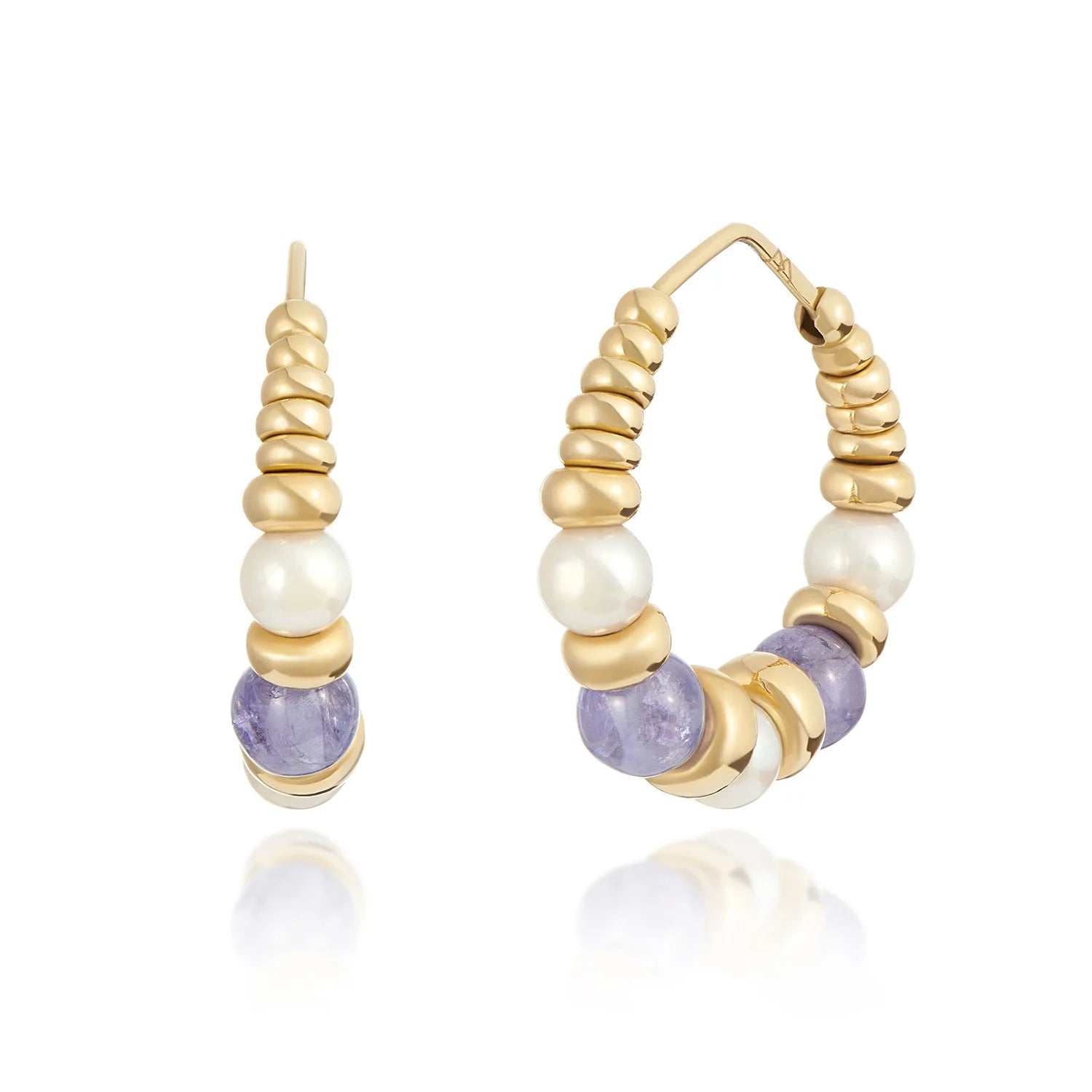 Tanzanite and pearl hoop earrings in 18k yellow gold featuring 30mm hoops with purple tanzanite beads and white freshwater pearls
