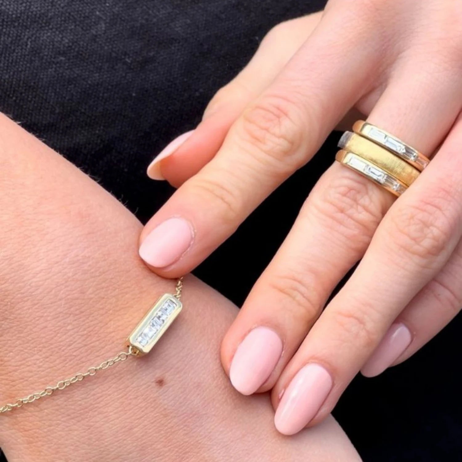 Close-up of Ley Line Avebury Rings Diamond hinge ring showing twelve baguette cut diamonds totaling 1.80ct in brushed 18k yellow and white gold
