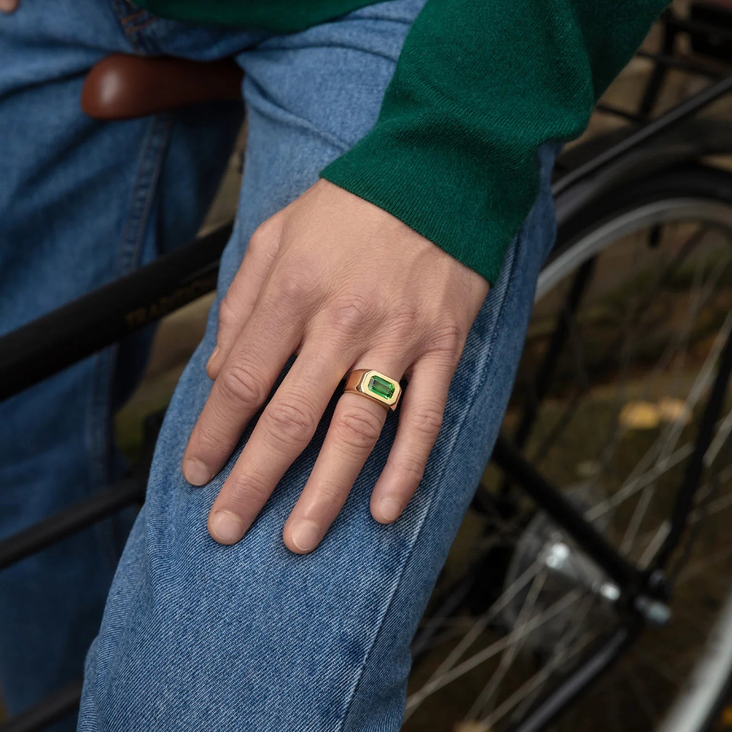 Model wearing Berlin Deep Green Tourmaline Ring, 18k gold with 2.5ct octagonal-cut green tourmaline, bold unisex style.