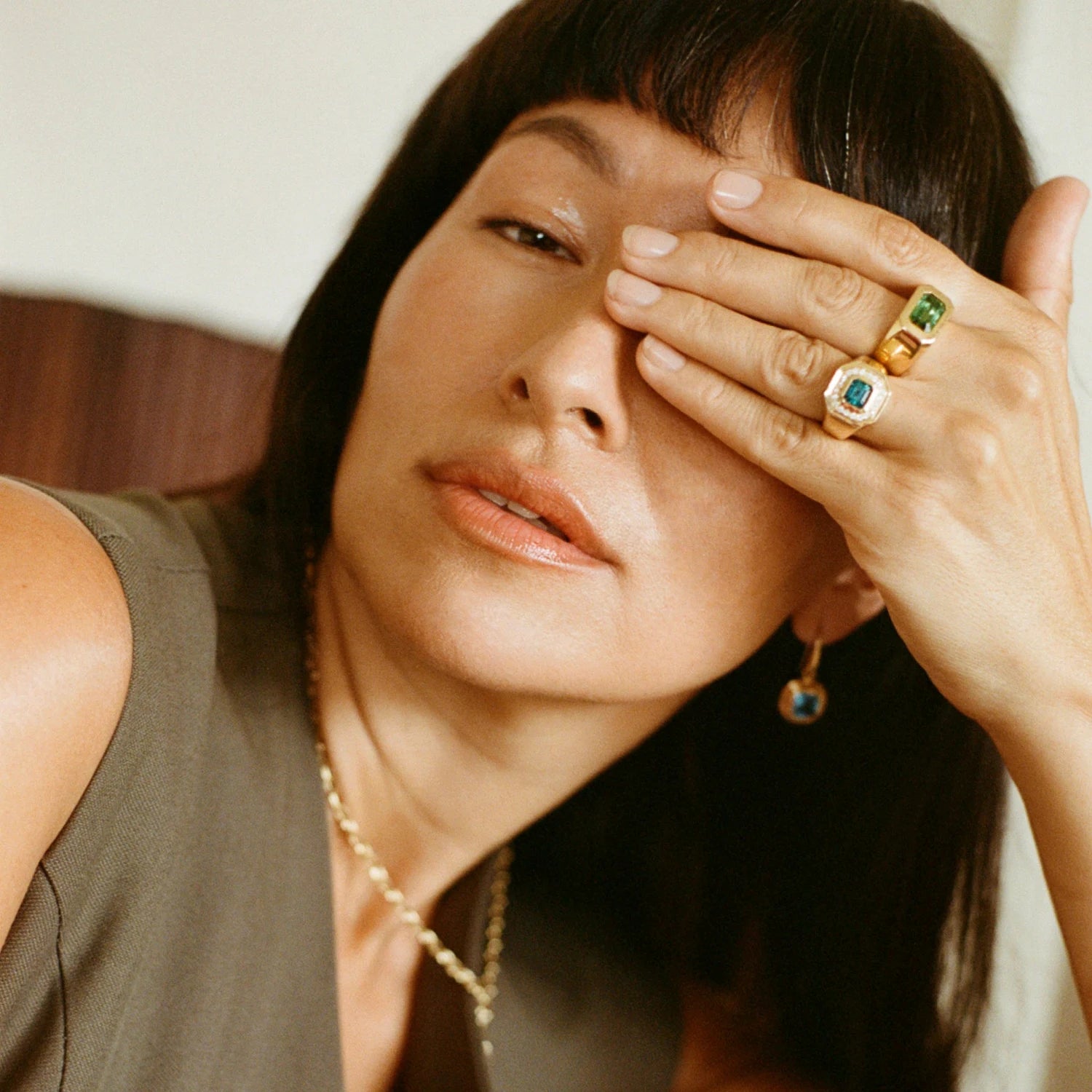 Model wearing Berlin Nights Indicolite Tourmaline Ring on hand, 18k gold, 2.98ct square octagonal-cut tourmaline, diamond halo.