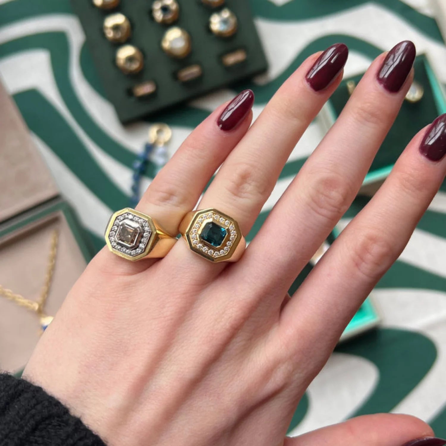Hand wearing Berlin Nights Indicolite Ring close-up, 2.98ct square octagonal-cut tourmaline, 0.35ct diamond halo, 18k gold statement ring.
