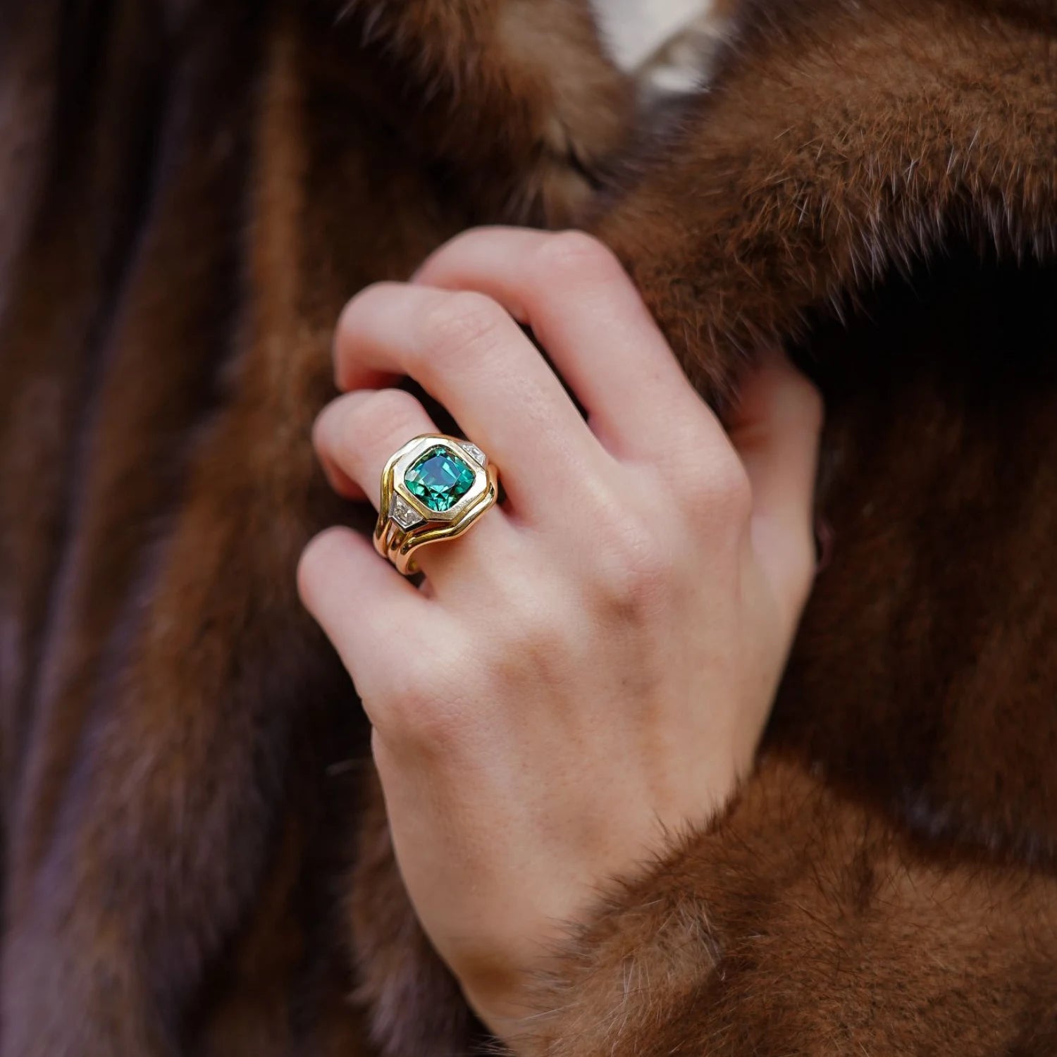 Model wearing Berlin Nights 5.96ct green tourmaline ring in 18k yellow gold and platinum with geometric-cut gemstone and diamonds