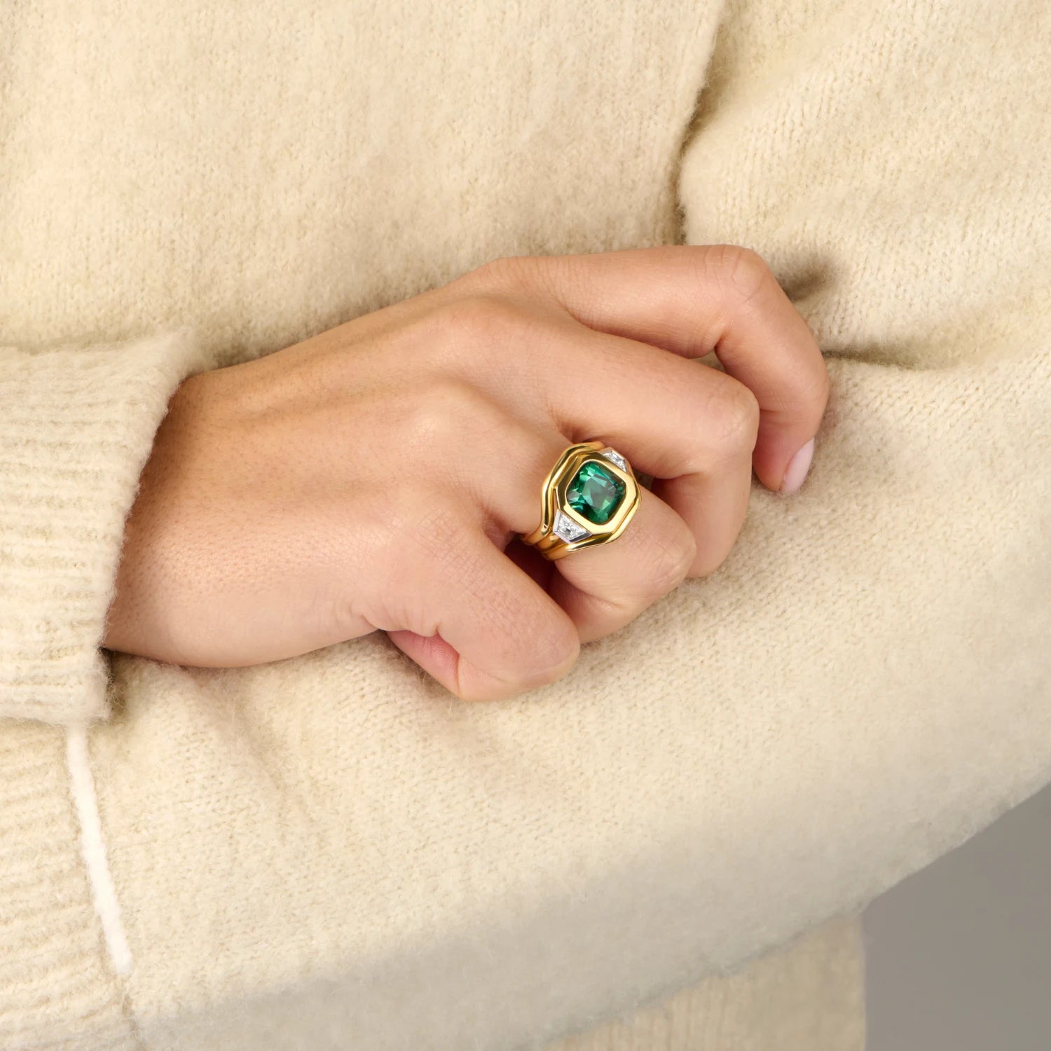 Hand model wearing Berlin Nights 5.96ct green tourmaline ring in 18k yellow gold and platinum with geometric-cut gemstone and diamonds