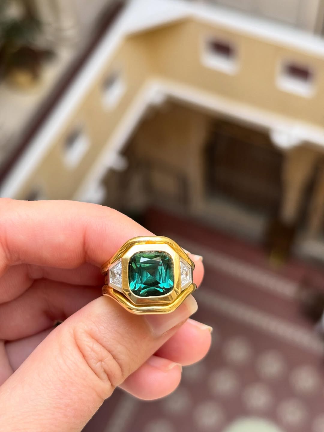 close up of 5.96ct green tourmaline and diamond Berlin ring with gold and platinum detailing by Minka Jewels