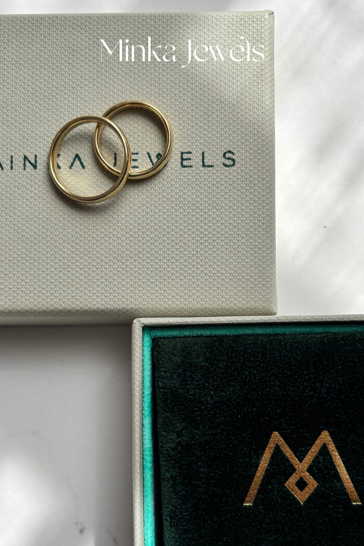 18k yellow gold Minka Jewels bangle stacked with other gold bracelets