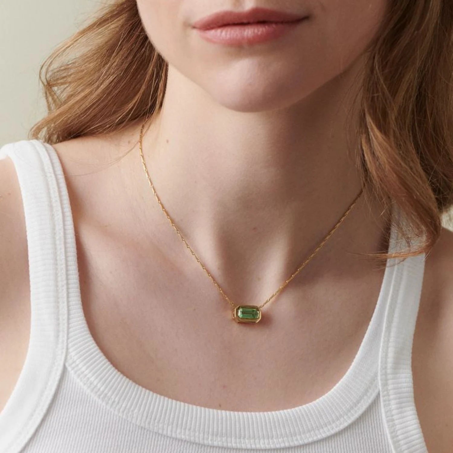Ley Lines Tourmaline Necklace in 18k yellow gold with 2.50ct green tourmaline centerpiece, suspended on a delicate hayseed chain, worn on model