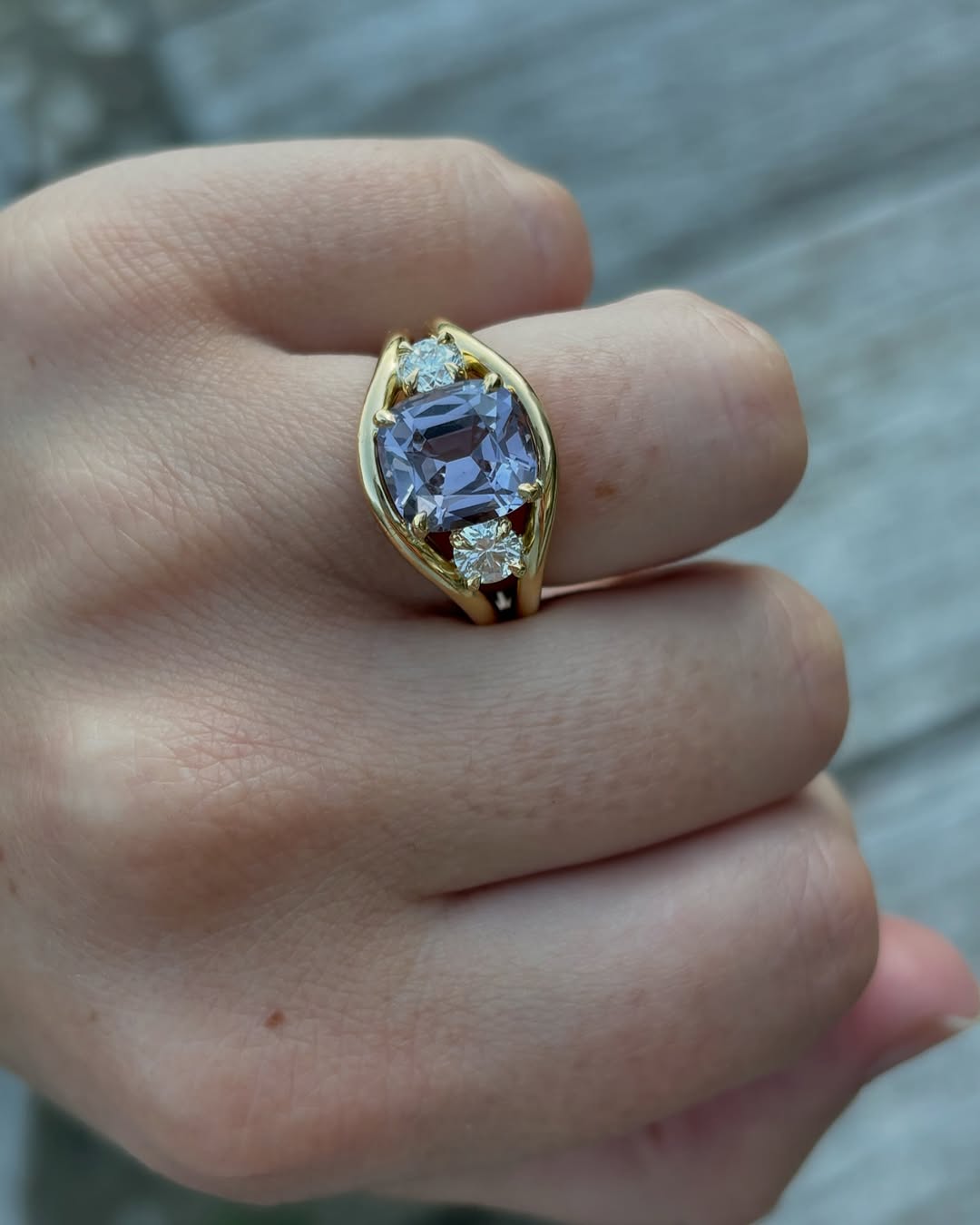 Atlantis lilac spinel and diamond ring in 18k yellow gold worn on model by Minka Jewels