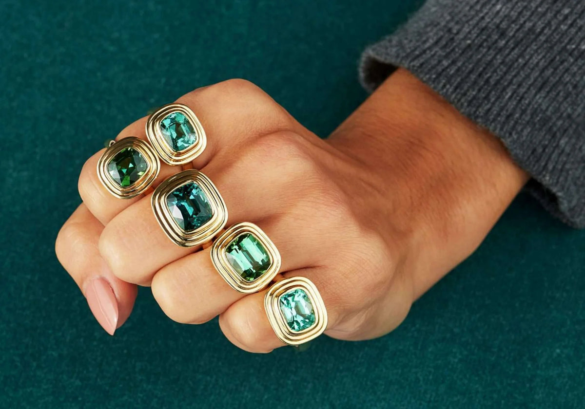 Hand model wearing athena rings minkajewels collection homepage banner