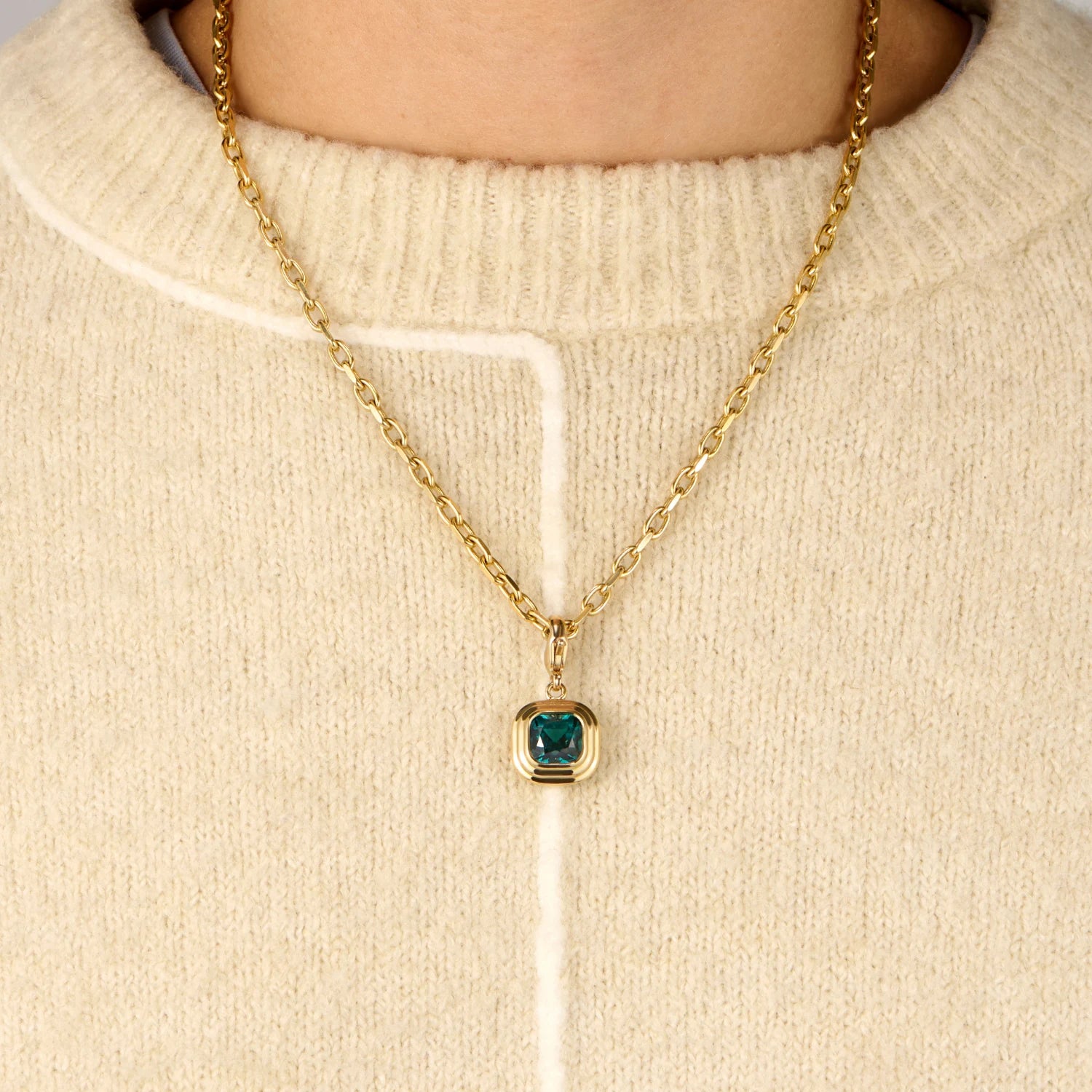 Model wearing Athena 4.40ct teal green tourmaline necklace in 18k yellow gold with square cushion-cut gemstone