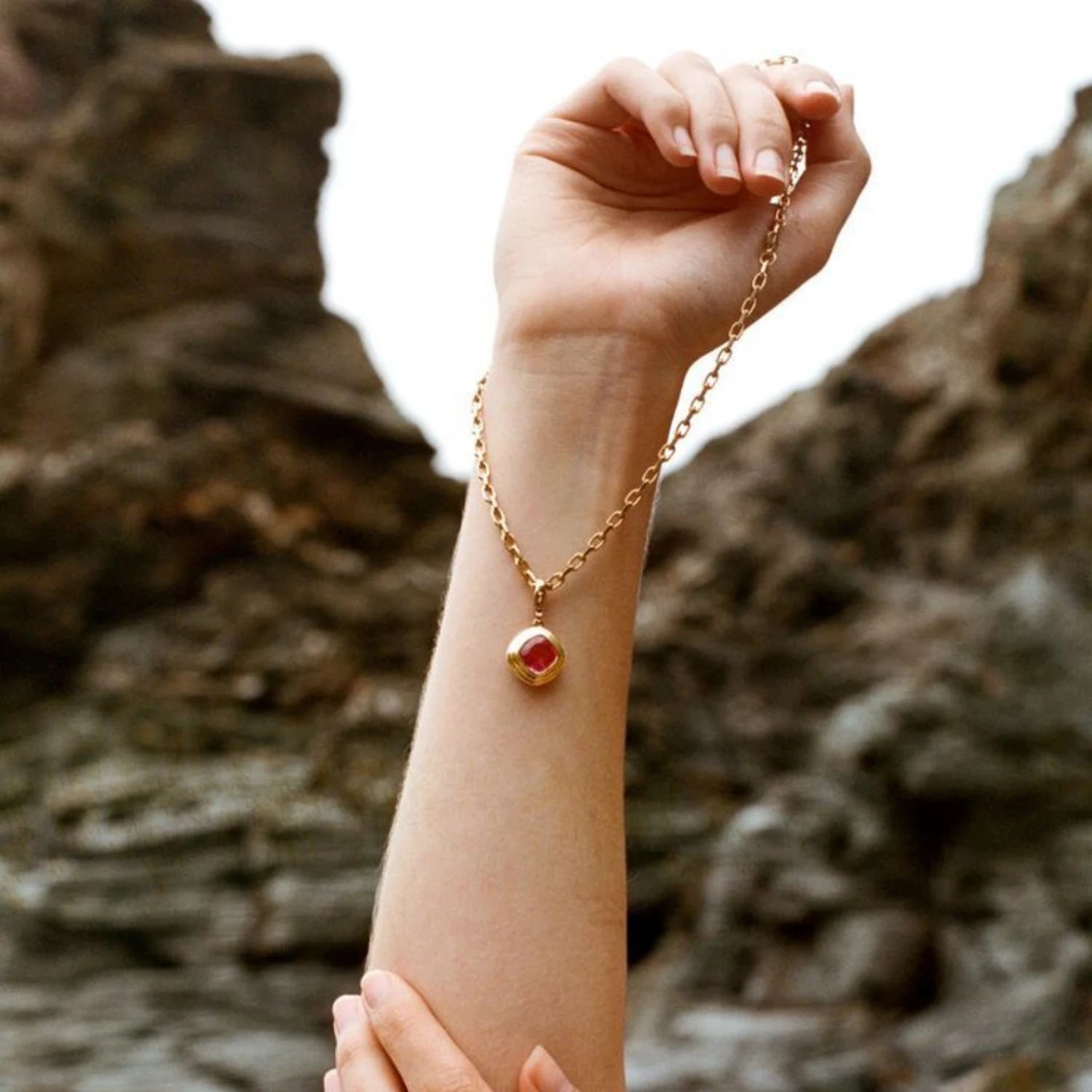 Close-up of Athena 18k yellow gold necklace with 4.50ct cushion-cut pink Tourmaline pendant on chunky chain
