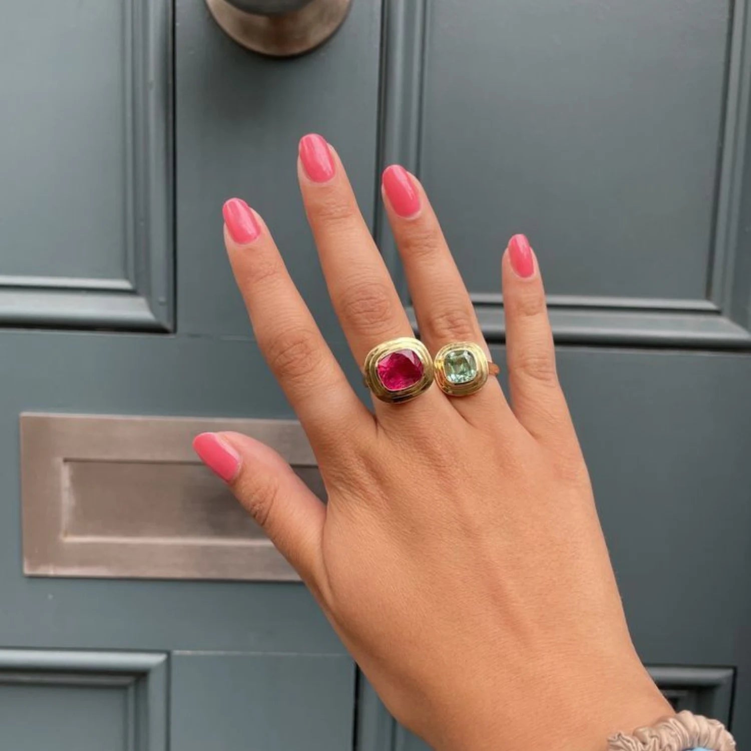 Hand wearing Athena 7.00ct pink tourmaline ring in 18k yellow gold with rare vivid rubellite tourmaline