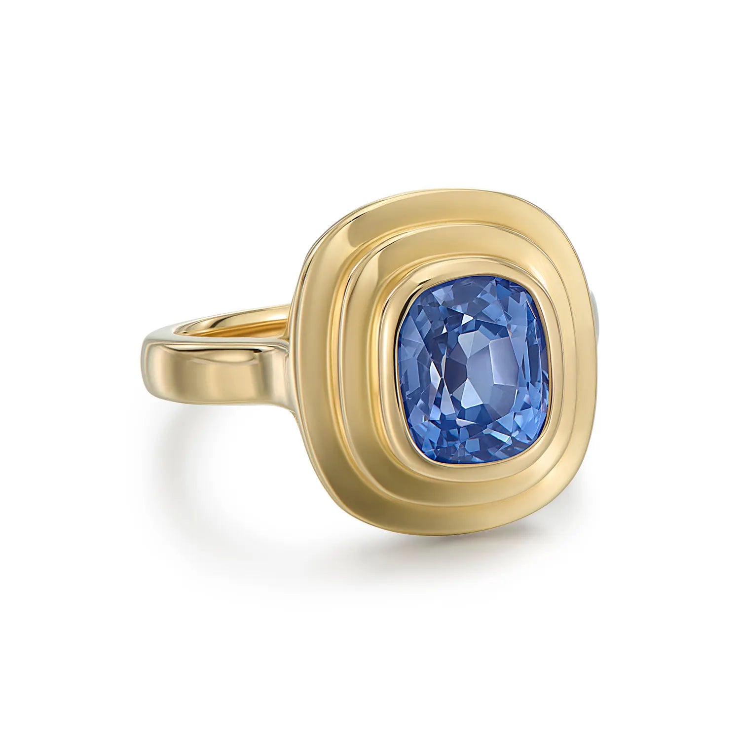 Side view of Athena blue sapphire ring in 18k yellow gold showing sculptural setting inspired by classical Greek architecture