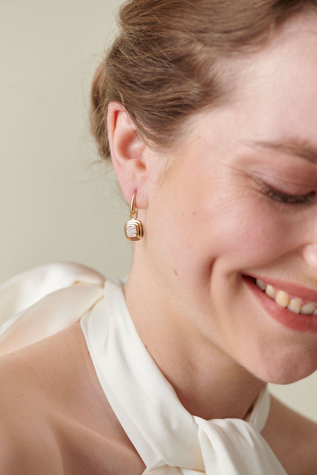 Athena diamond earrings in 18k yellow gold worn by Minka Jewels model