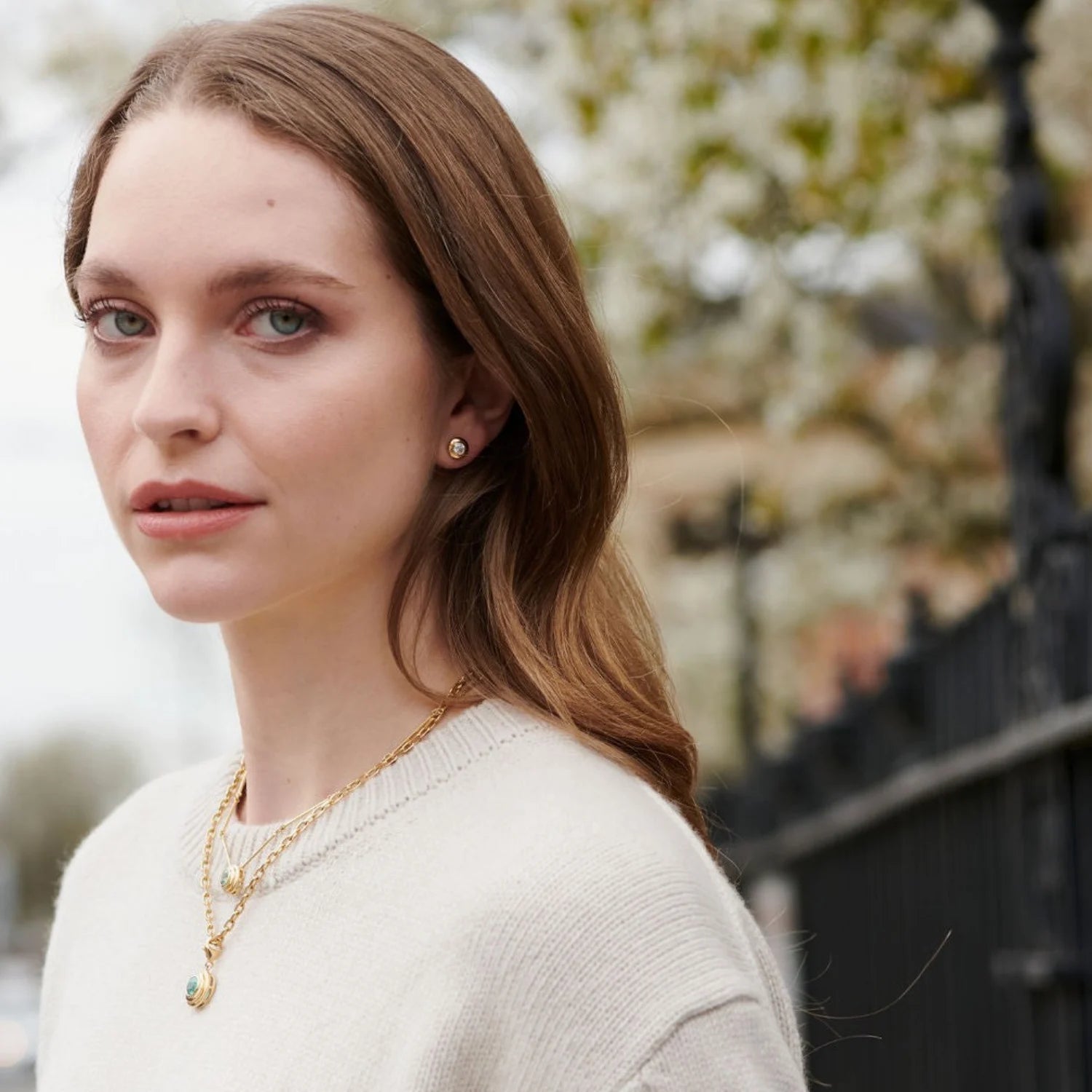 Athena diamond stud earrings in 18k yellow gold styled with athena gemstone gold necklaces