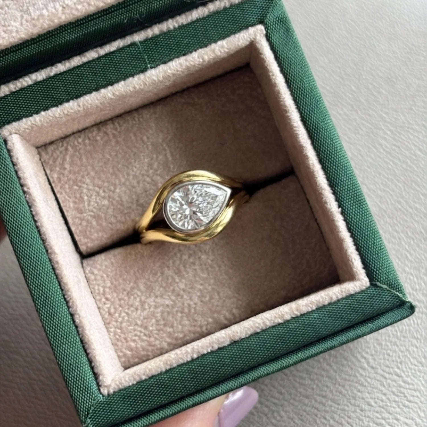 Atlantis 2.02ct Diamond Mermaid Ring in yellow and white gold with 2.02ct pear-shaped lab-grown white diamond on mermaid tail-inspired band in minka jewels jewellery box