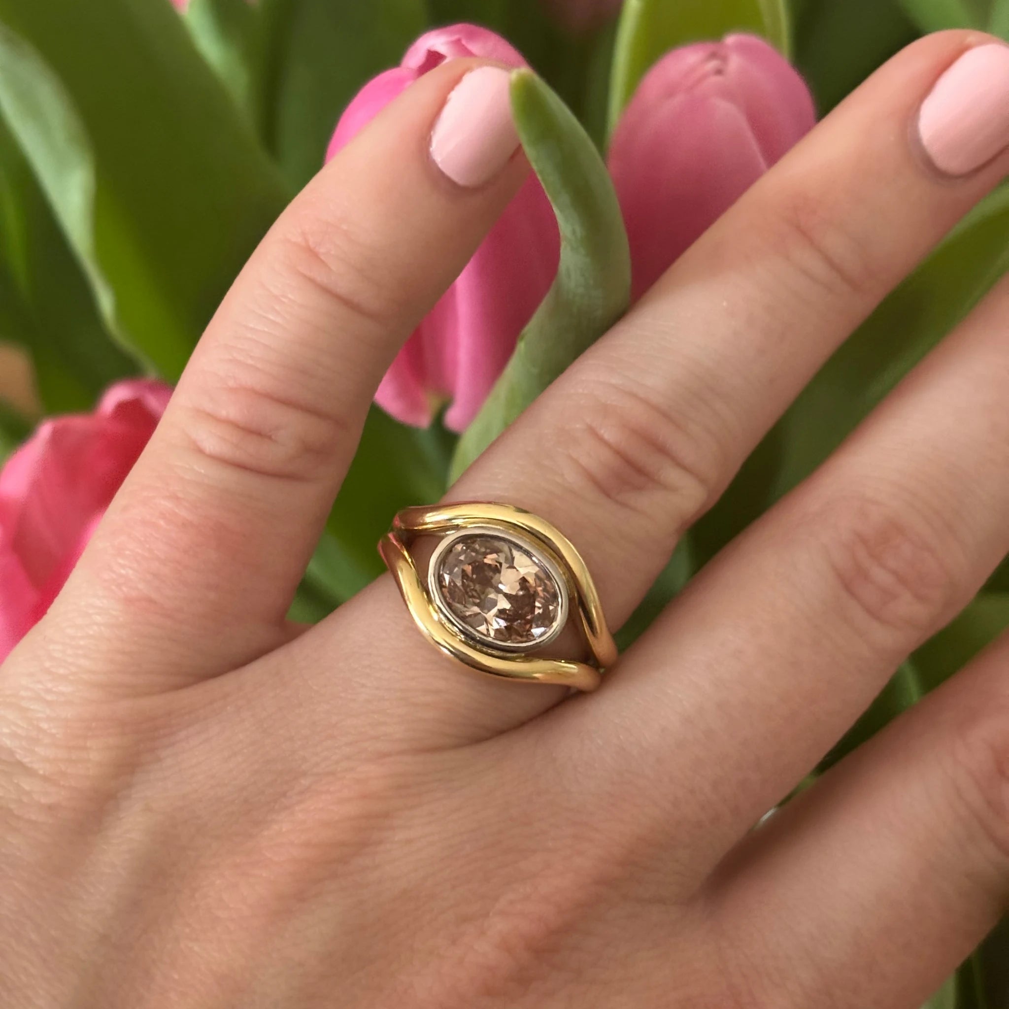 Close-up of Atlantis 2.04ct brown diamond mermaid ring in yellow and white gold with oval-shaped lab-grown brown diamond