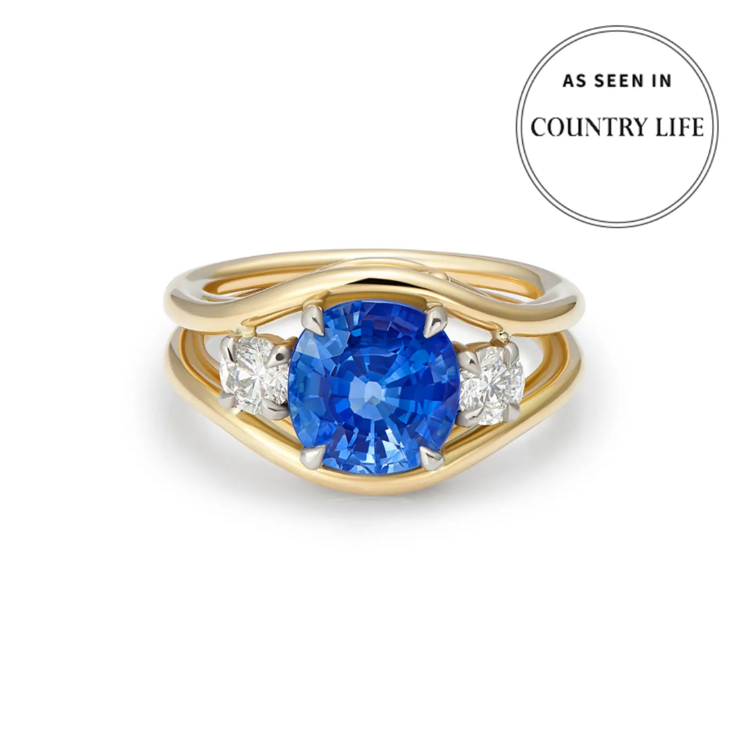 Front view of Atlantis mermaid ring with 2.72ct cornflower blue sapphire and white diamonds in 18k yellow gold as seen in country life