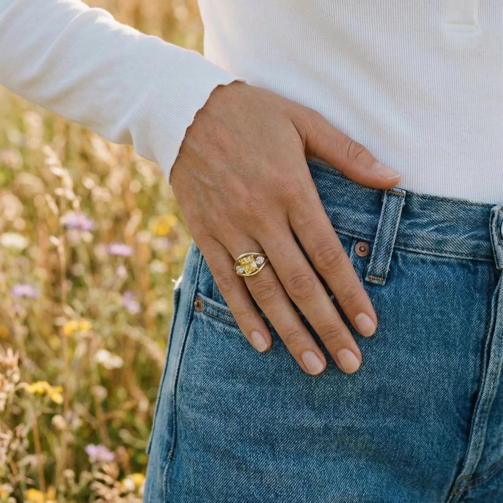 Close-up of Atlantis 2.95ct yellow sapphire mermaid ring in 18k yellow gold with square cushion-cut no-heat yellow sapphire and round white diamonds