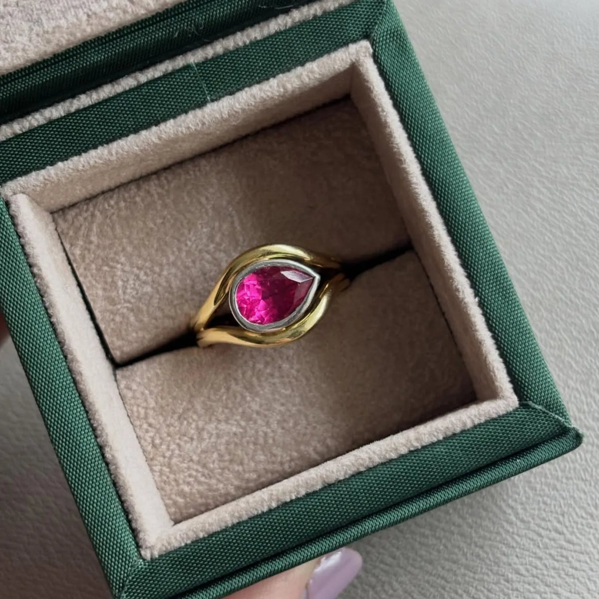 Close up of Pink tourmaline Atlantis mermaid ring handcrafted in yellow and white gold with flowing curves