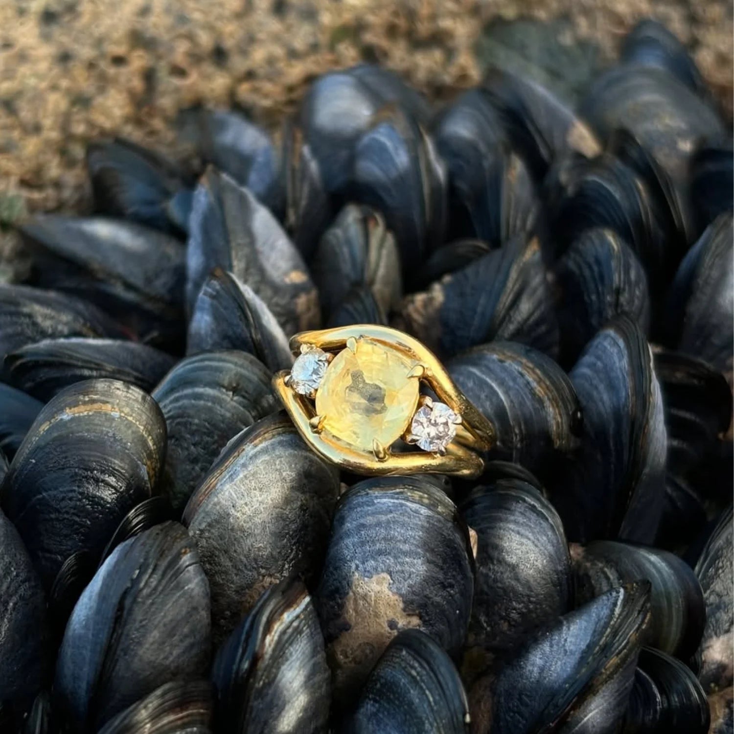 Close up of Atlantis mermaid ring with 3.00ct untreated yellow sapphire and round white diamonds in 18k yellow gold