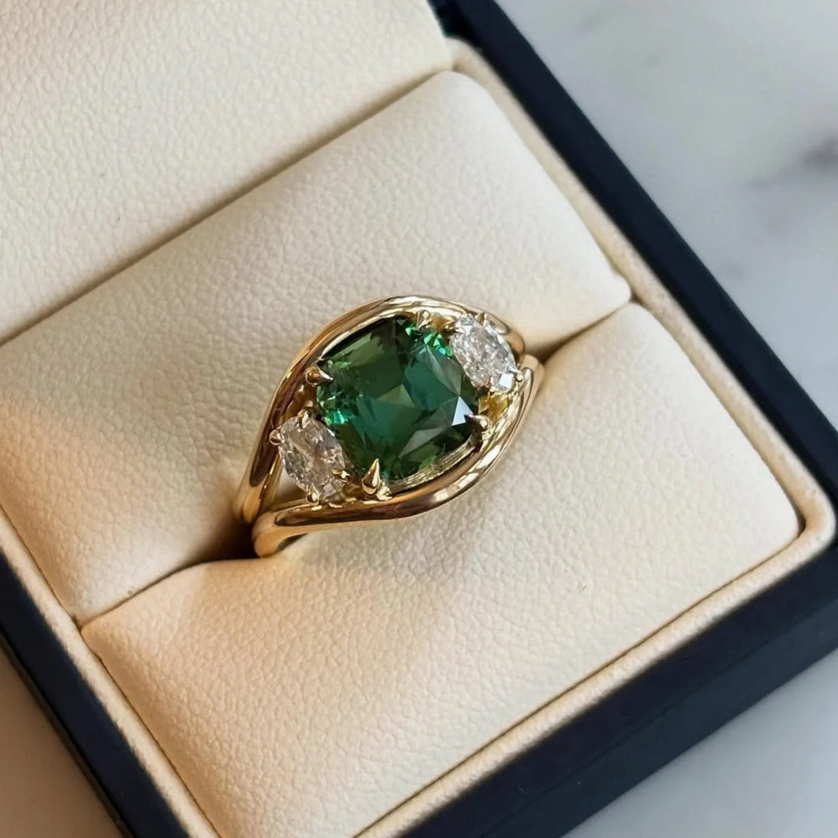 Atlantis 4.70ct vivid green tourmaline mermaid ring in 18k yellow gold with 0.65ct white diamonds displayed in a jewellery box