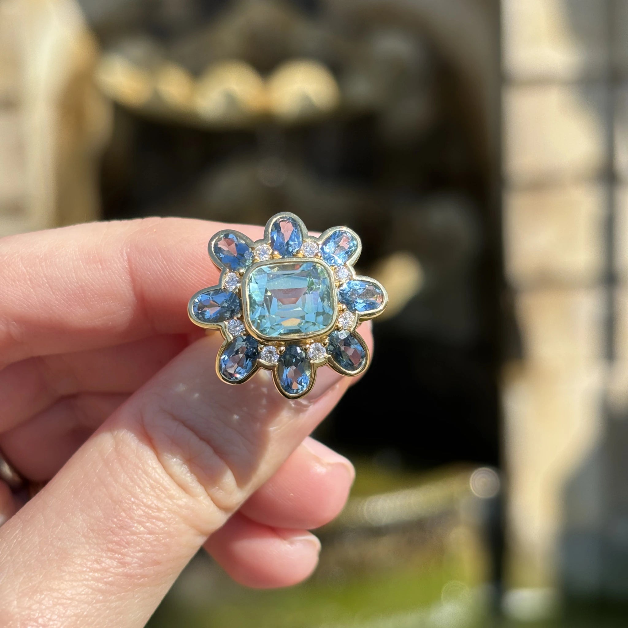 Flower shaped Atlantis collection 18k yellow gold ring featuring 5.30ct green Tourmaline, 3.39ct Aquamarine, and diamonds