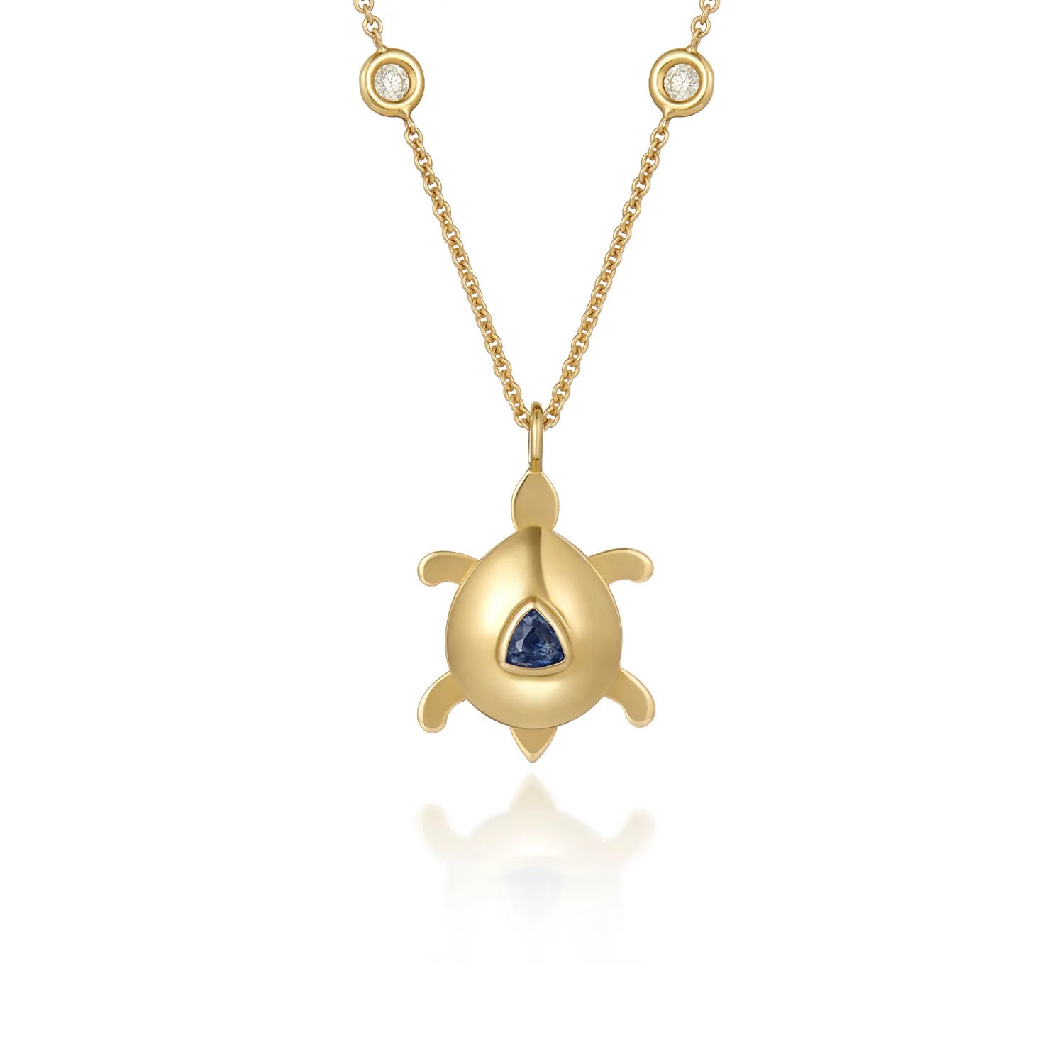 Atlantis dancing turtle sapphire charm in 18k yellow gold with trillion-cut sapphire worn on a cord or gold chain