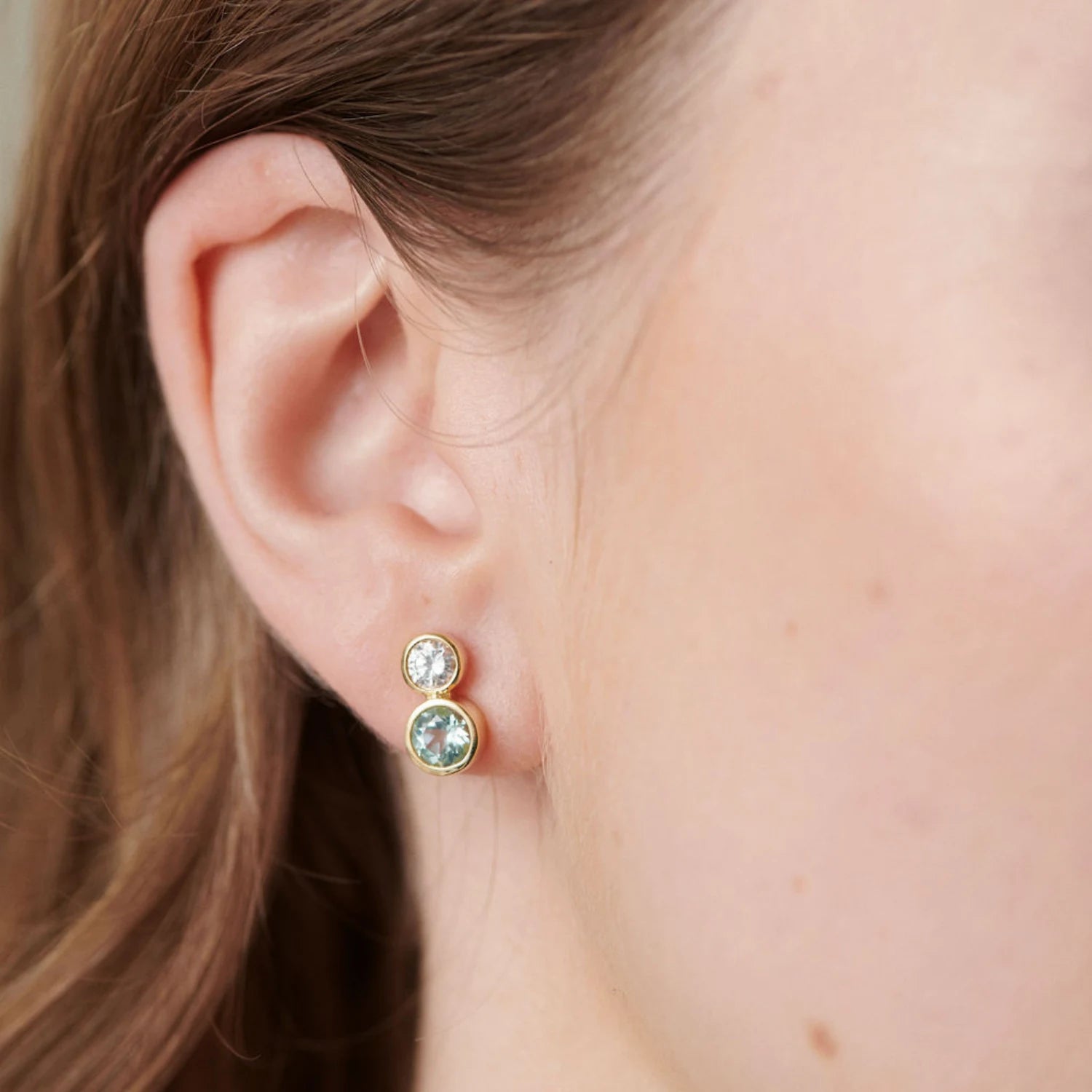Close-up of Atlantis Diamond and Tourmaline Stud Earrings in 18k yellow gold with 0.50ct total diamonds and 1.39ct sea green tourmaline