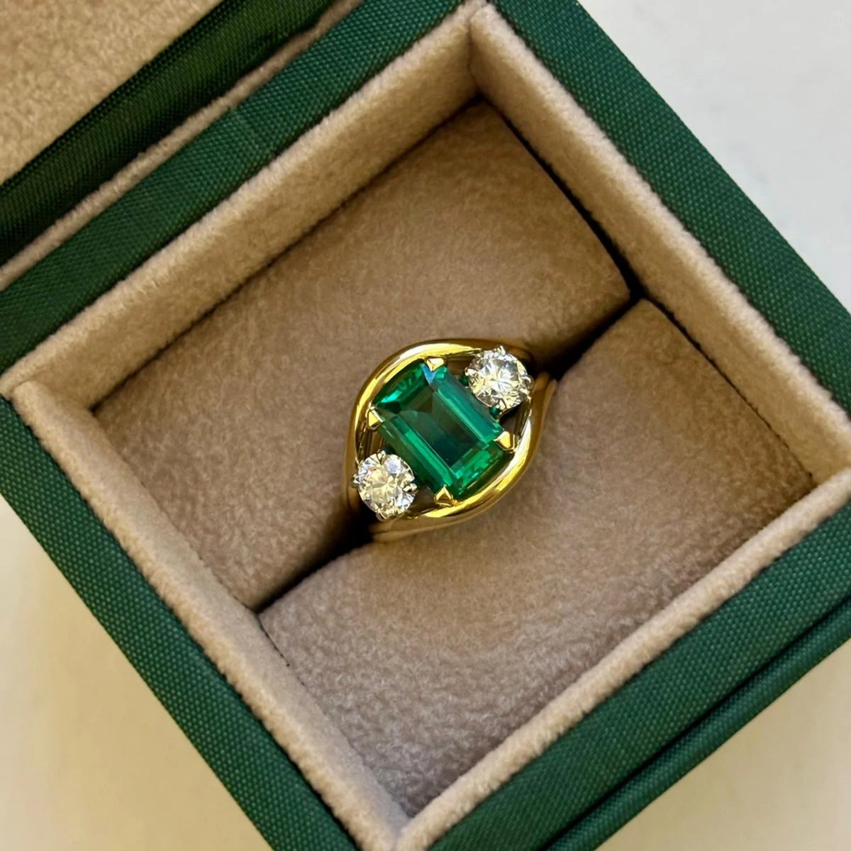 Close-up of Atlantis green sapphire mermaid ring in 18k yellow gold with cushion-cut sapphire and round white diamonds