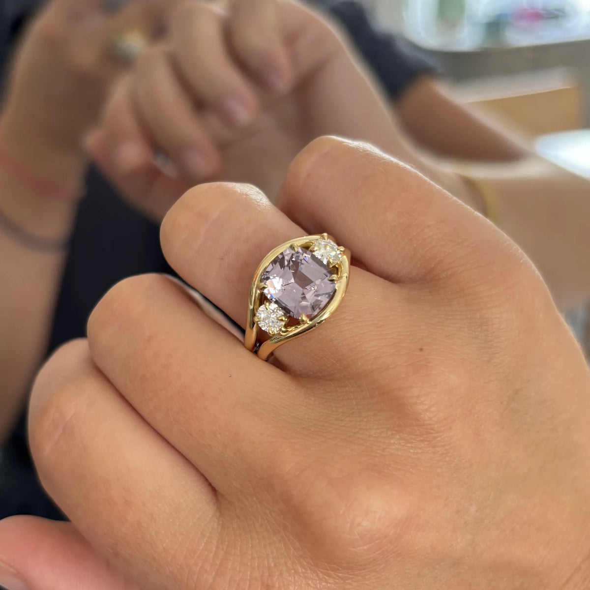 Close-up of Atlantis Lilac sapphire mermaid ring in 18k yellow gold with square cushion-cut lilac sapphire and round white diamonds