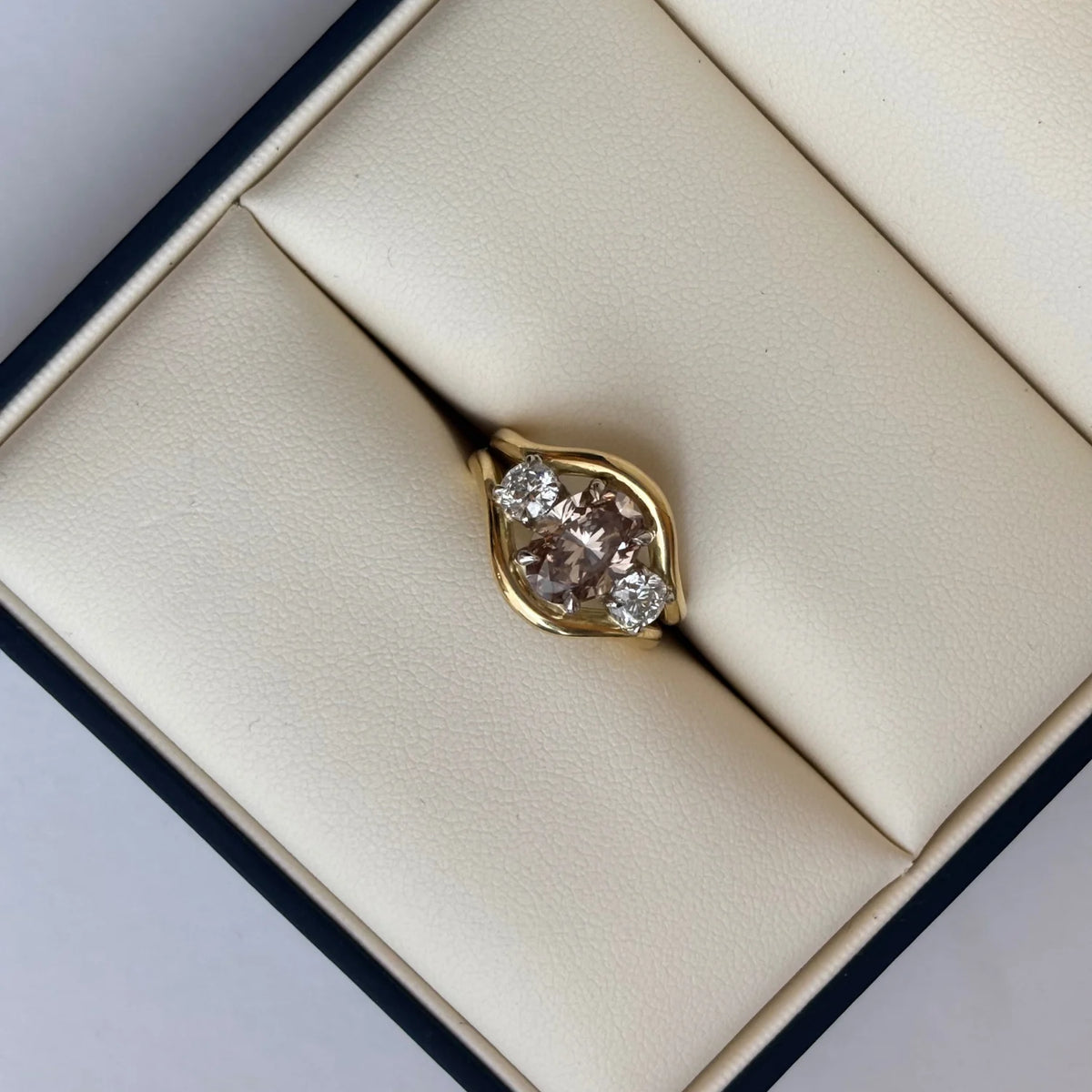 Close-up of Atlantis Lilac sapphire mermaid ring in 18k yellow gold with square cushion-cut lilac sapphire and round white diamonds