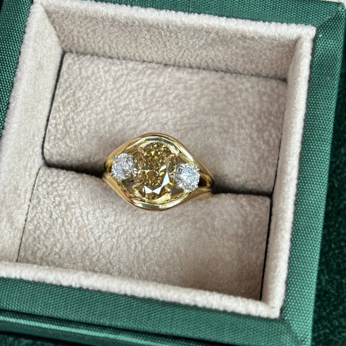 Close-up of Atlantis yellow sapphire mermaid ring in 18k yellow gold with square cushion-cut sapphire and round white diamonds
