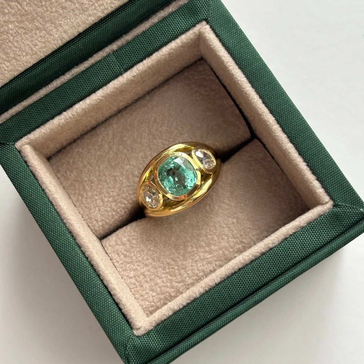 Close-up of Atlantis Small Ocean Blue Tourmaline Mermaid Ring in 18k yellow gold with round-cut ocean blue tourmaline and round white diamonds