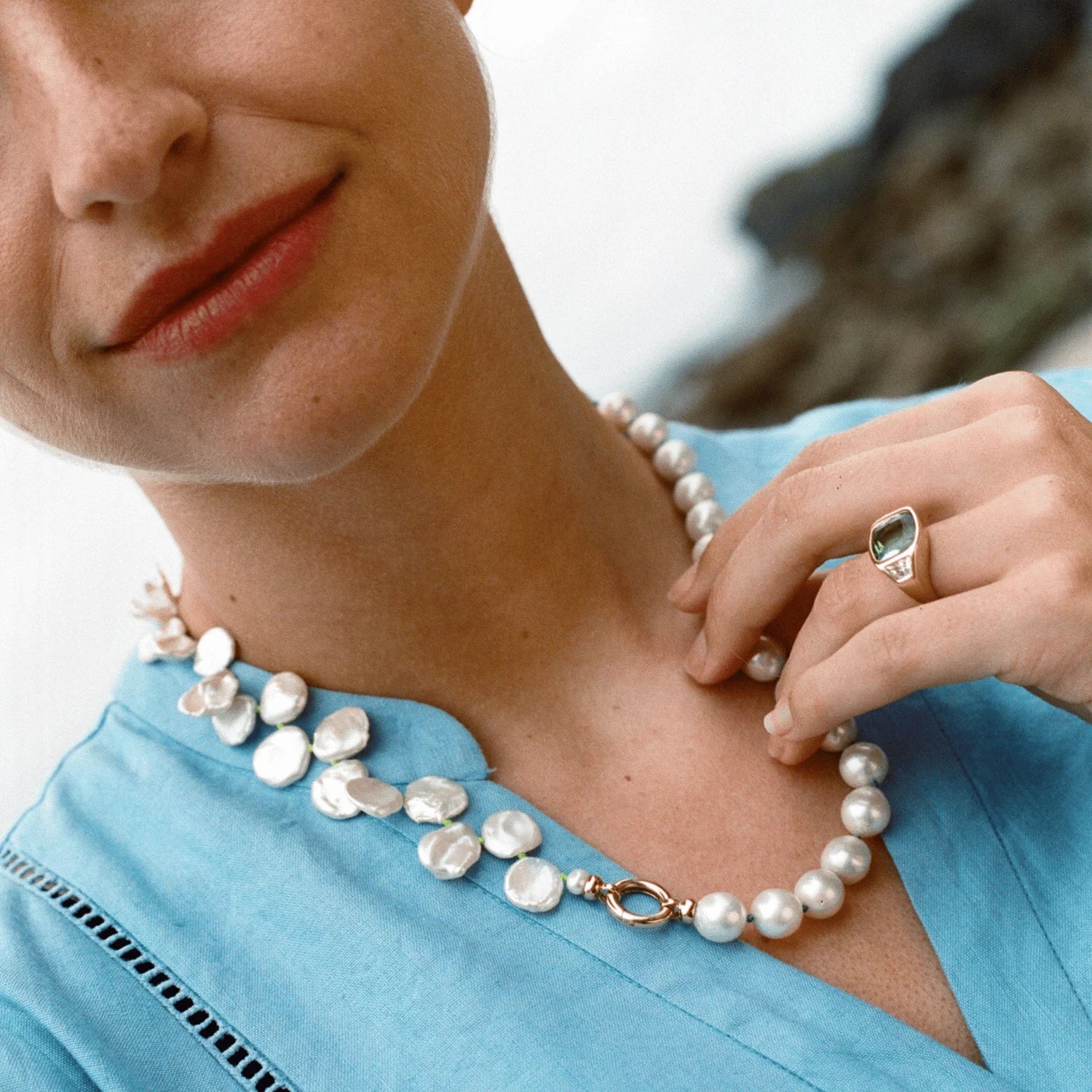 Model wearing Atlantis collection 18k yellow gold necklace featuring white Keshi pearls