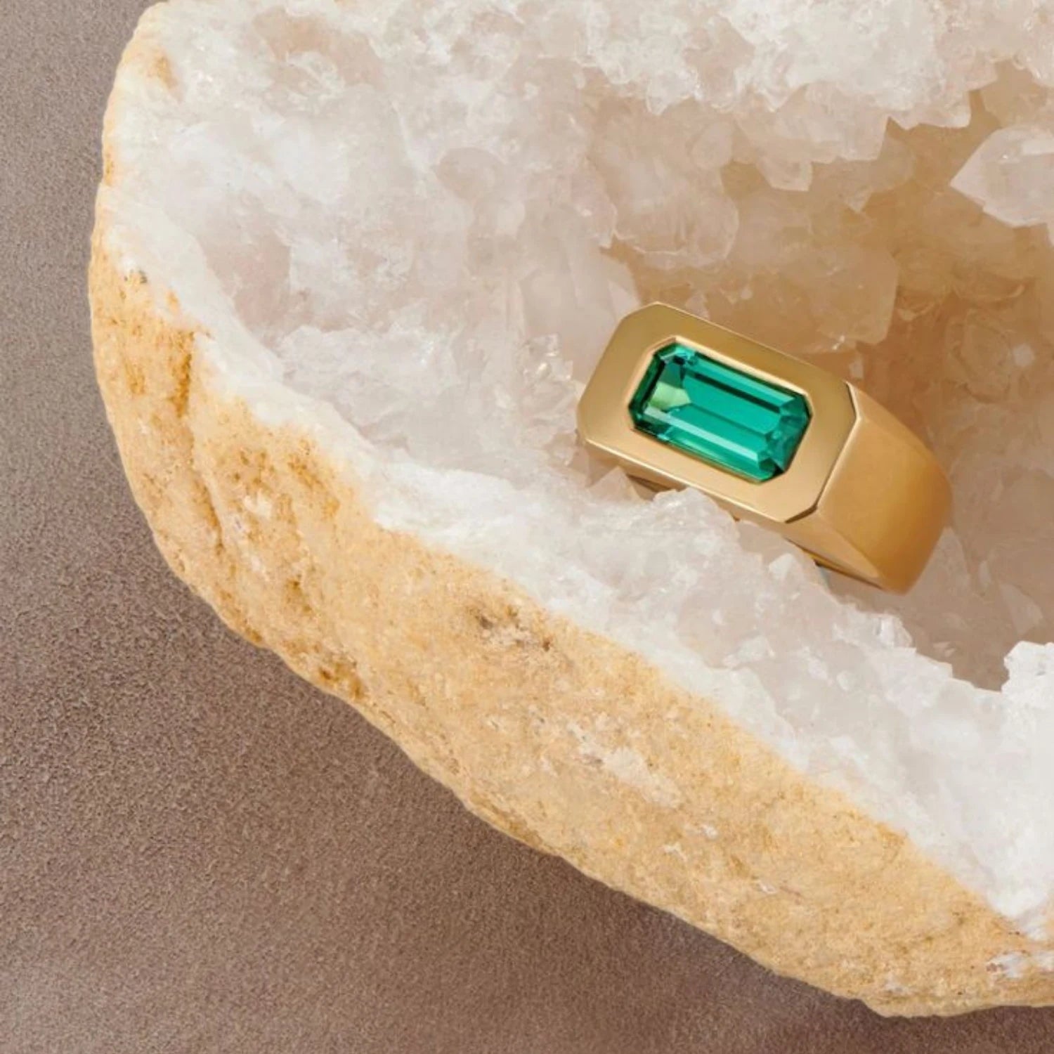 Close-up of teal tourmaline gypsy ring showing 1.50ct deep-set tourmaline in smooth 18k yellow gold band.