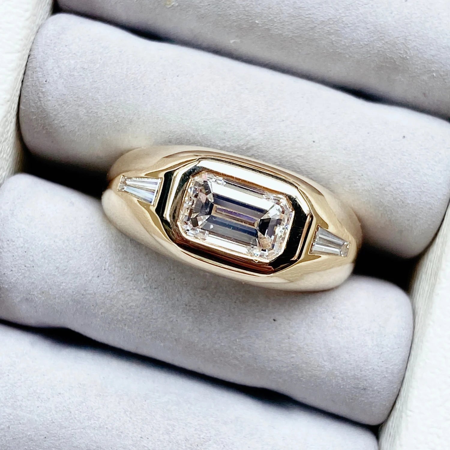 Close-up of Berlin Gypsy Diamond Ring in 18k yellow gold with 2ct emerald-cut diamond and 0.40ct tapered baguette side diamonds.